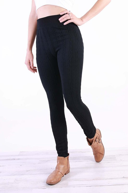 A pair of stylish Cable Knit Plus Leggings in various colors, featuring a soft fleece lining and a textured cable knit design.