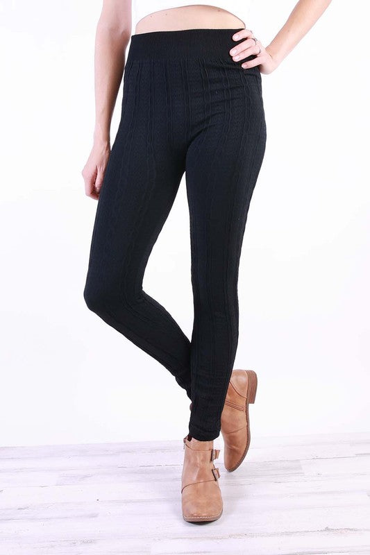 A pair of stylish Cable Knit Plus Leggings in various colors, featuring a soft fleece lining and a textured cable knit design.