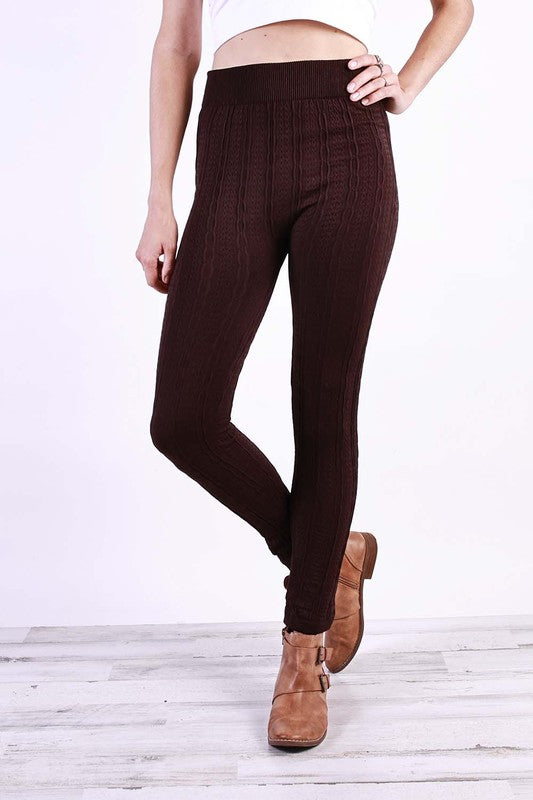 A pair of stylish Cable Knit Plus Leggings in various colors, featuring a soft fleece lining and a textured cable knit design.