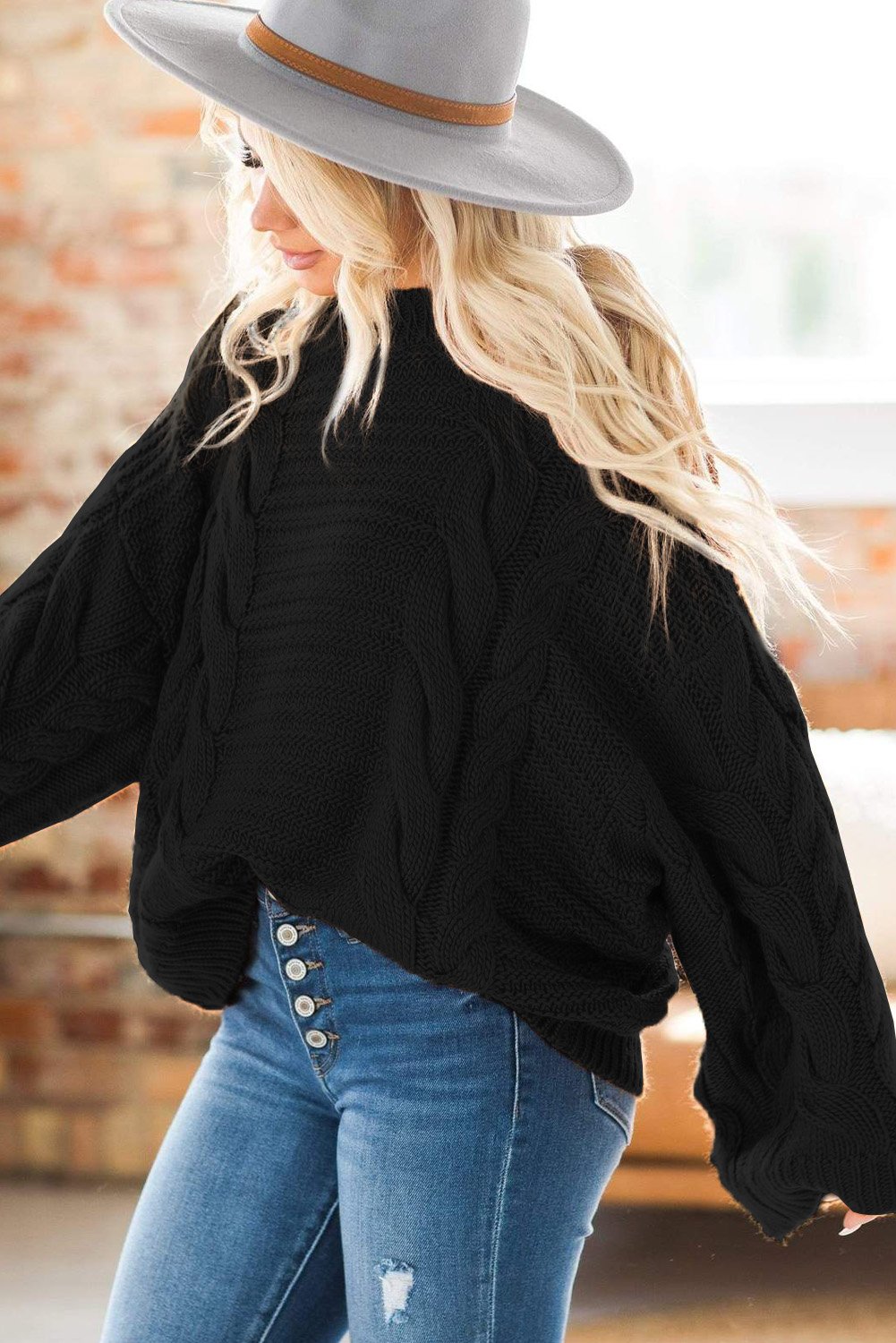 A cozy Cable Knit Sweater featuring batwing sleeves and a relaxed fit, perfect for casual wear.