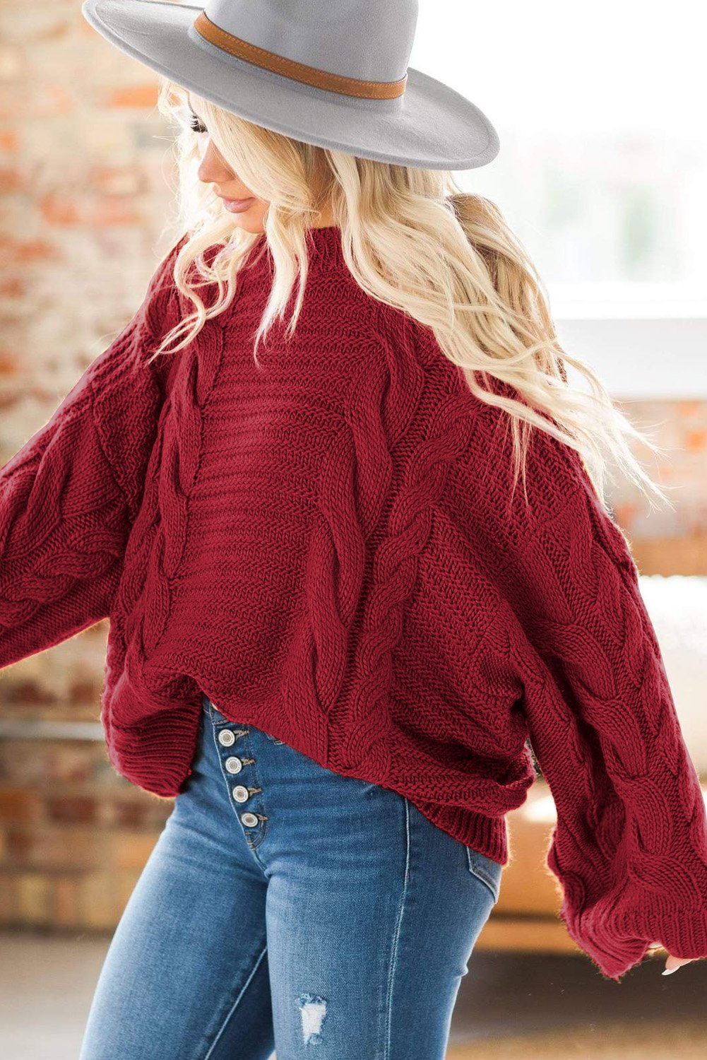 A cozy Cable Knit Sweater featuring batwing sleeves and a relaxed fit, perfect for casual wear.