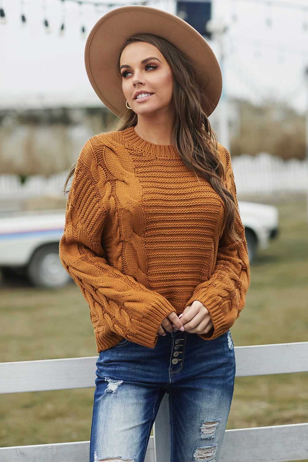 A cozy Cable Knit Sweater featuring batwing sleeves and a relaxed fit, perfect for casual wear.