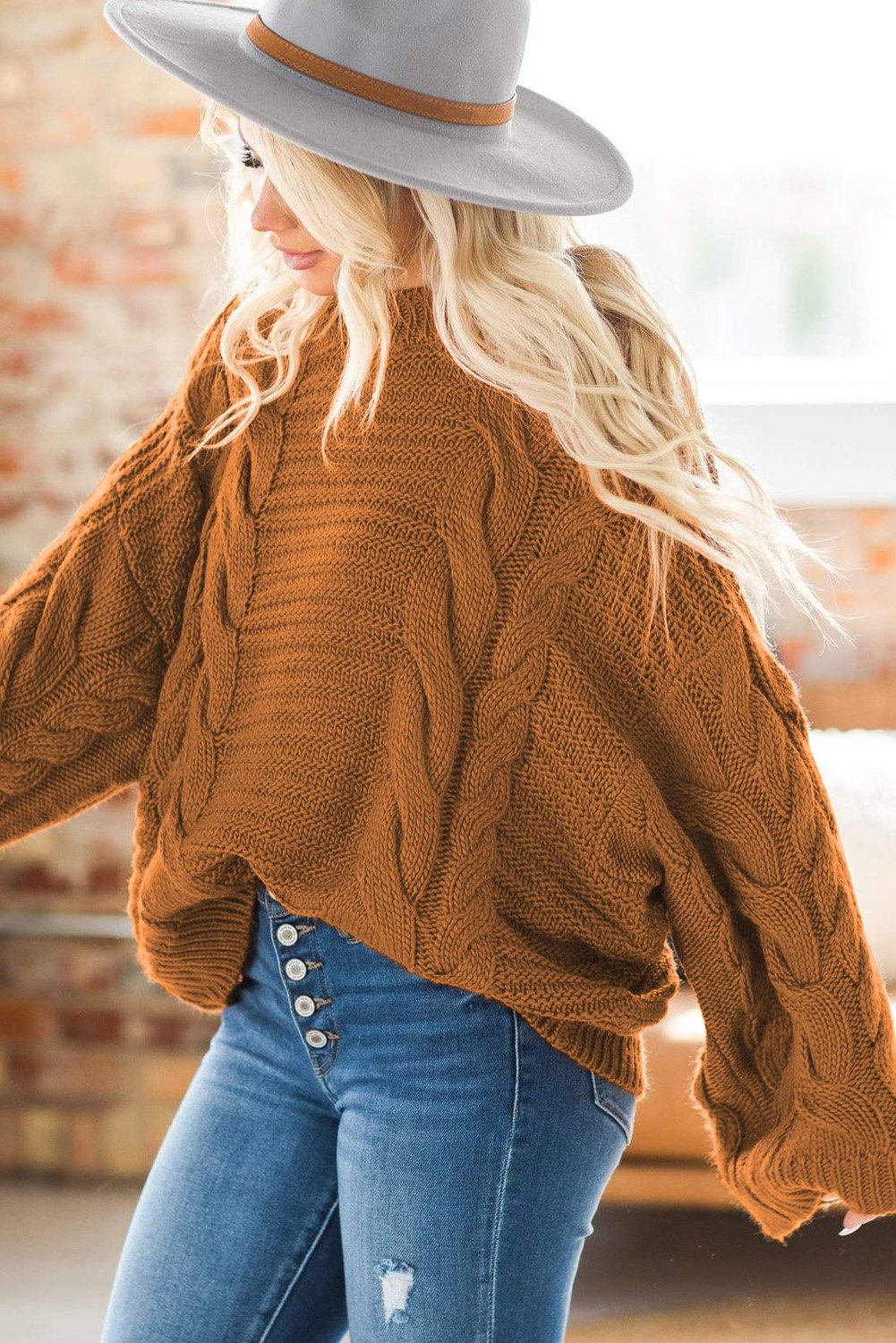 A cozy Cable Knit Sweater featuring batwing sleeves and a relaxed fit, perfect for casual wear.