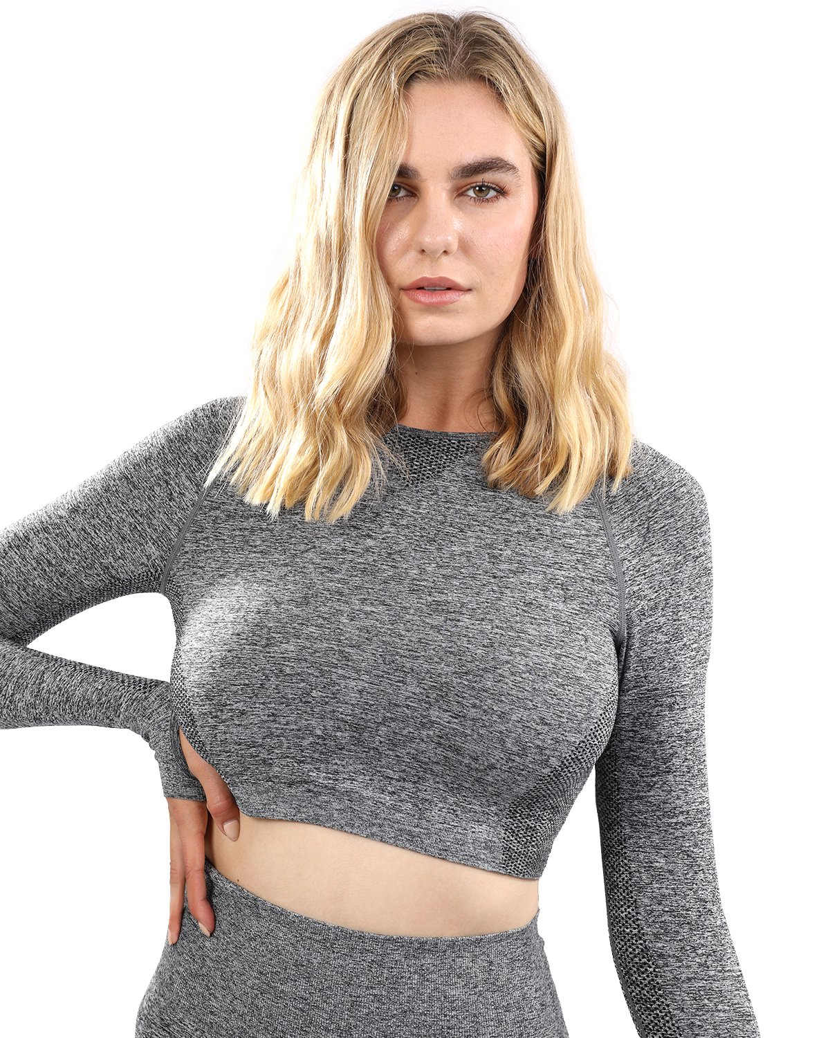 Cadrina Seamless Sports Top in grey featuring long sleeves and thumb holes, designed for comfort and style during workouts.