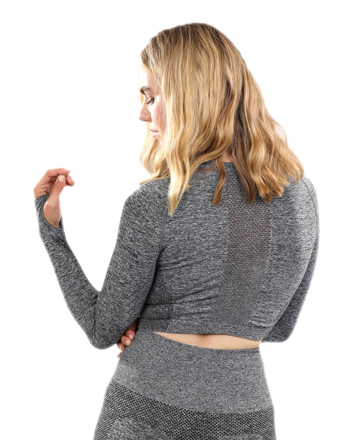 Cadrina Seamless Sports Top in grey featuring long sleeves and thumb holes, designed for comfort and style during workouts.