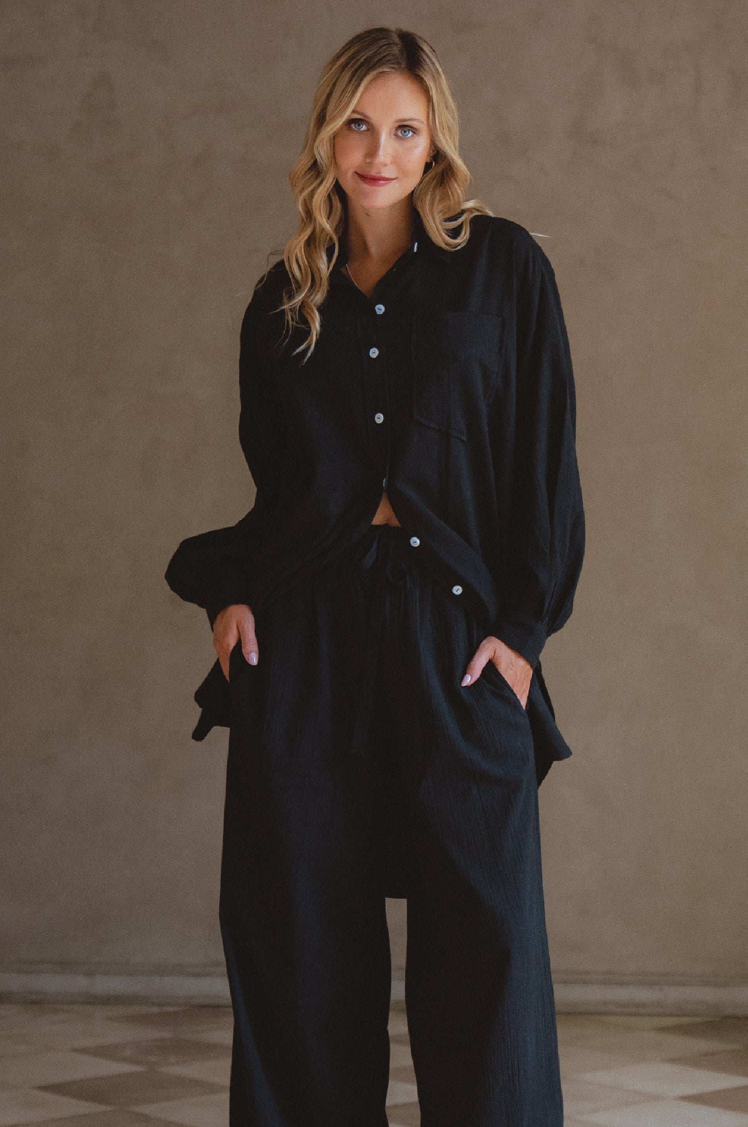 Calin Long Sleeve Oversized Shirt made from breathable linen, featuring a button-down style and high-low hem, displayed on a mannequin.