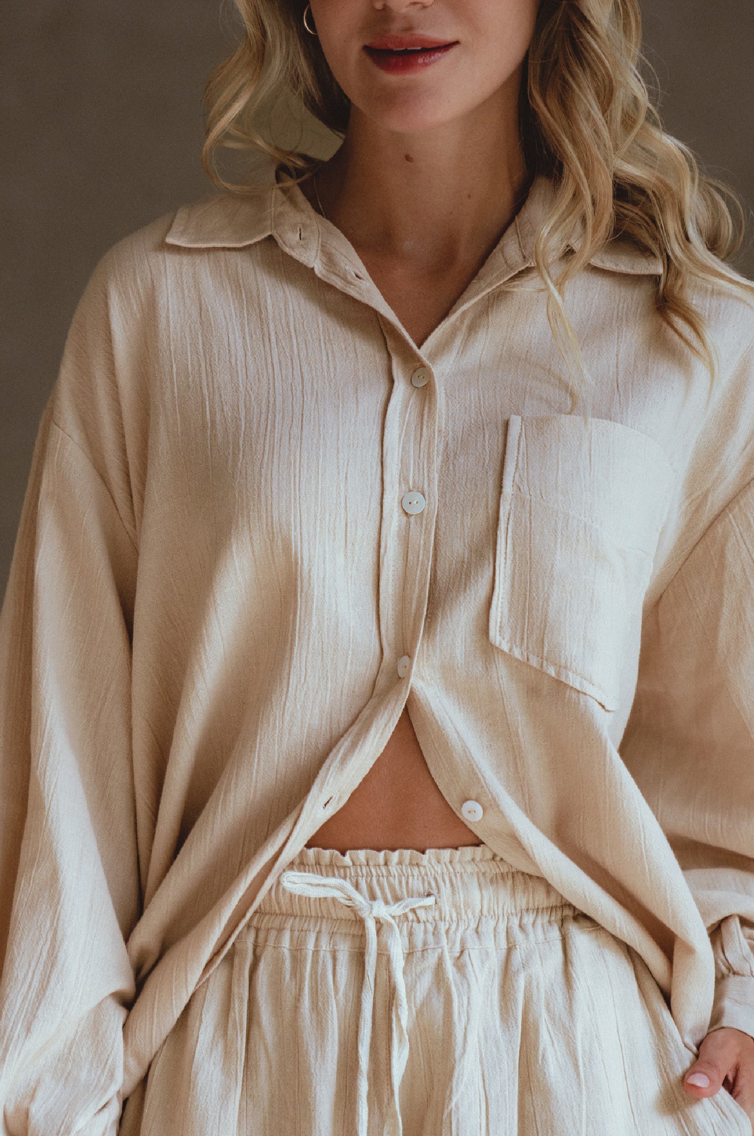 Calin Long Sleeve Oversized Shirt made from breathable linen, featuring a button-down style and high-low hem, displayed on a mannequin.