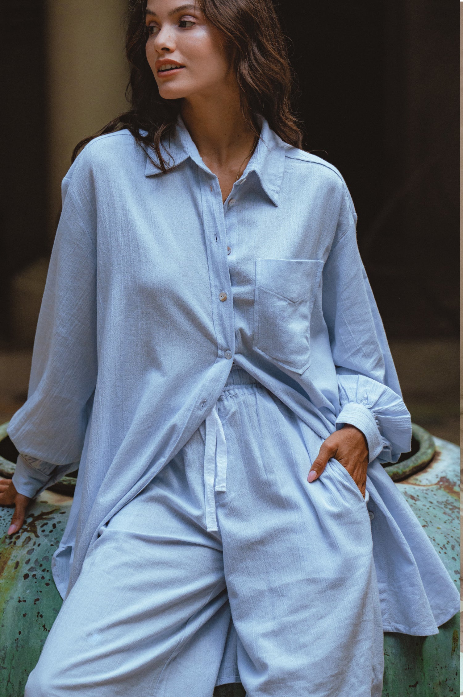 Calin Long Sleeve Oversized Shirt made from breathable linen, featuring a button-down style and high-low hem, displayed on a mannequin.