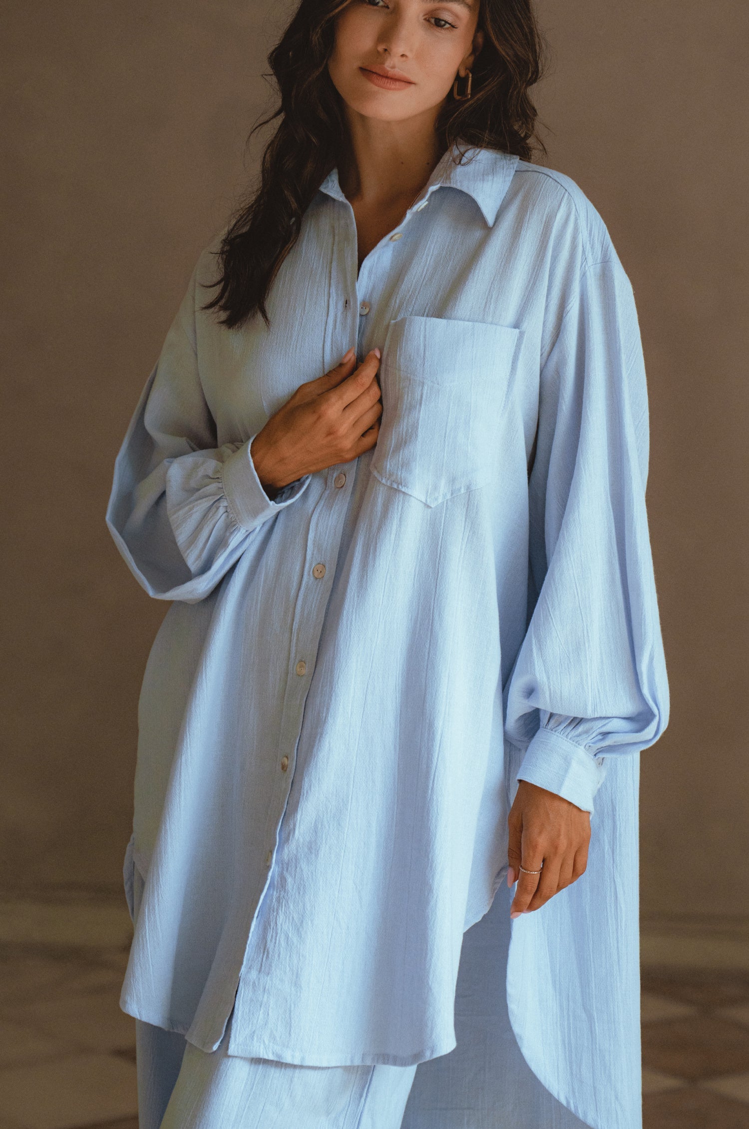 Calin Long Sleeve Oversized Shirt made from breathable linen, featuring a button-down style and high-low hem, displayed on a mannequin.