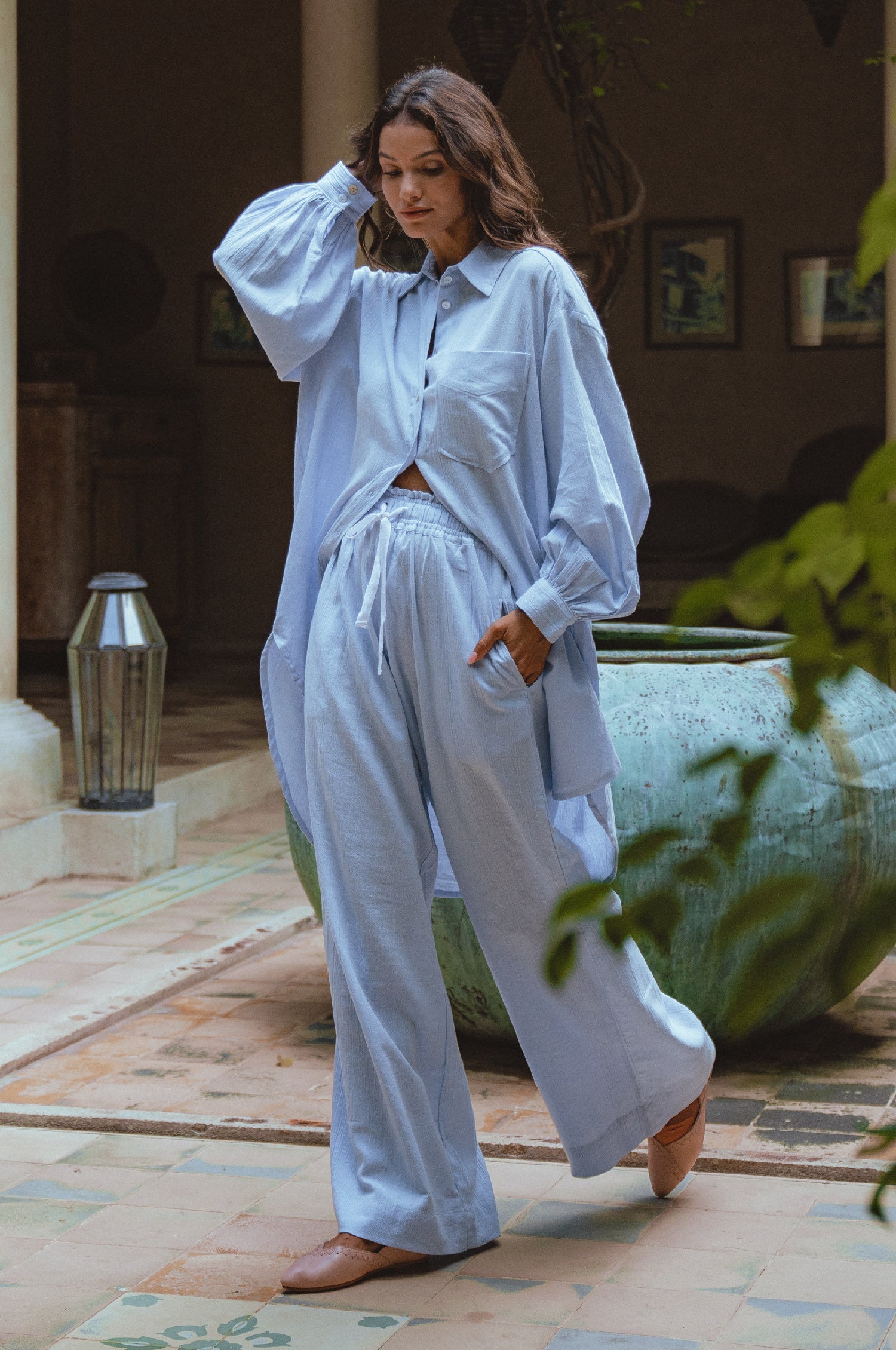 Calin Long Sleeve Oversized Shirt made from breathable linen, featuring a button-down style and high-low hem, displayed on a mannequin.