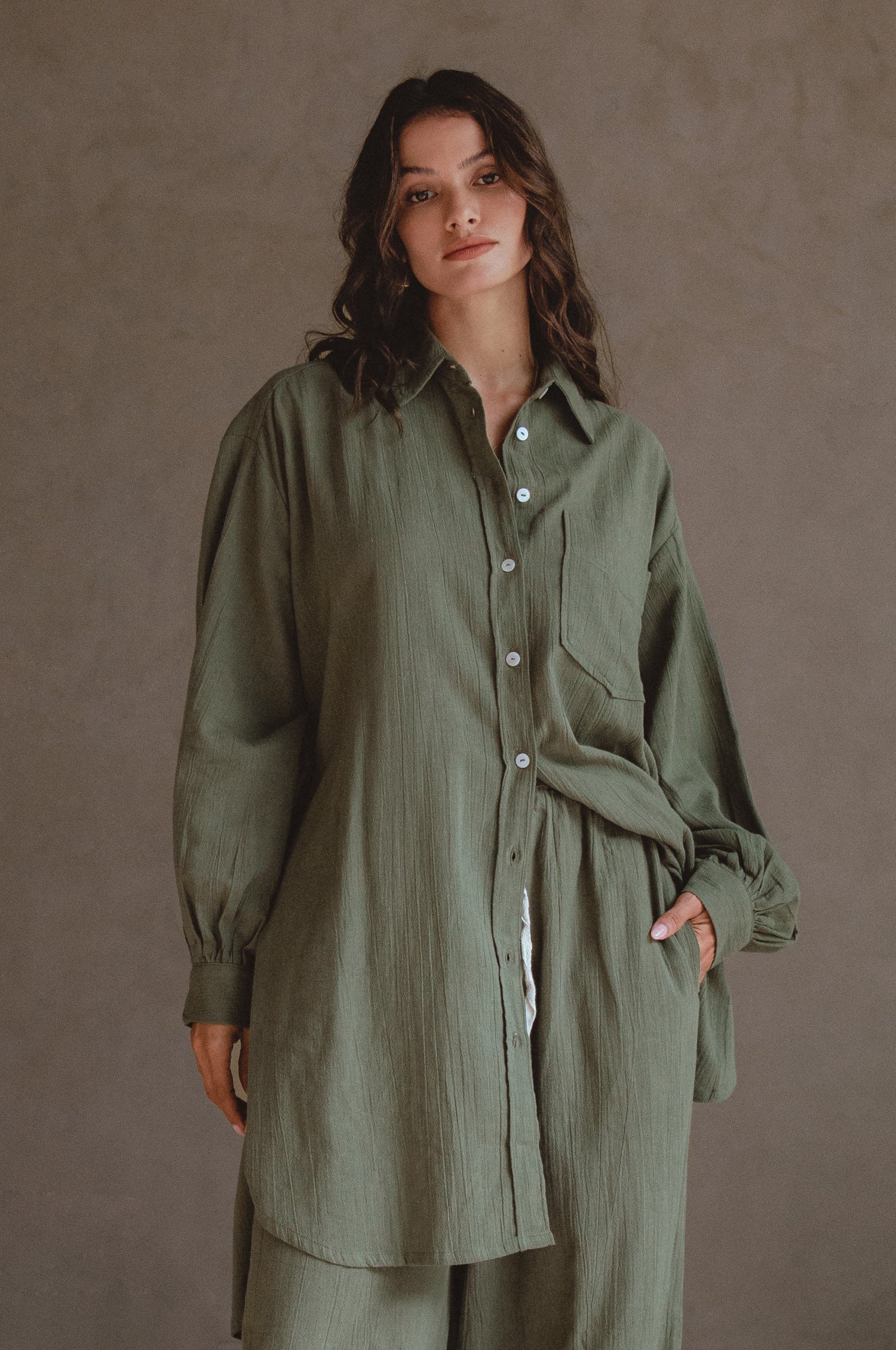 Calin Long Sleeve Oversized Shirt made from breathable linen, featuring a button-down style and high-low hem, displayed on a mannequin.