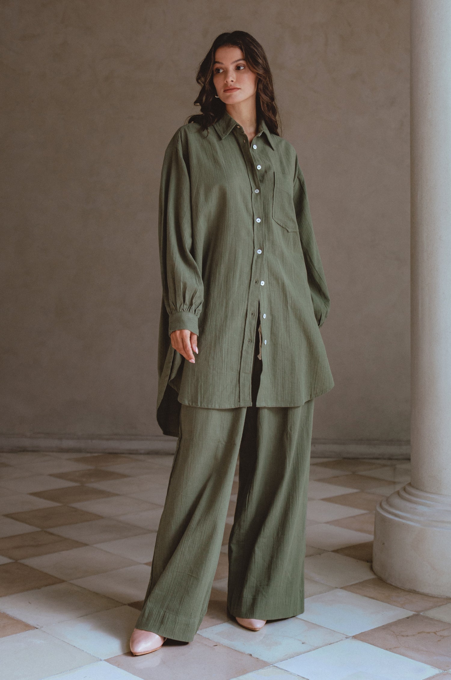 Calin Long Sleeve Oversized Shirt made from breathable linen, featuring a button-down style and high-low hem, displayed on a mannequin.