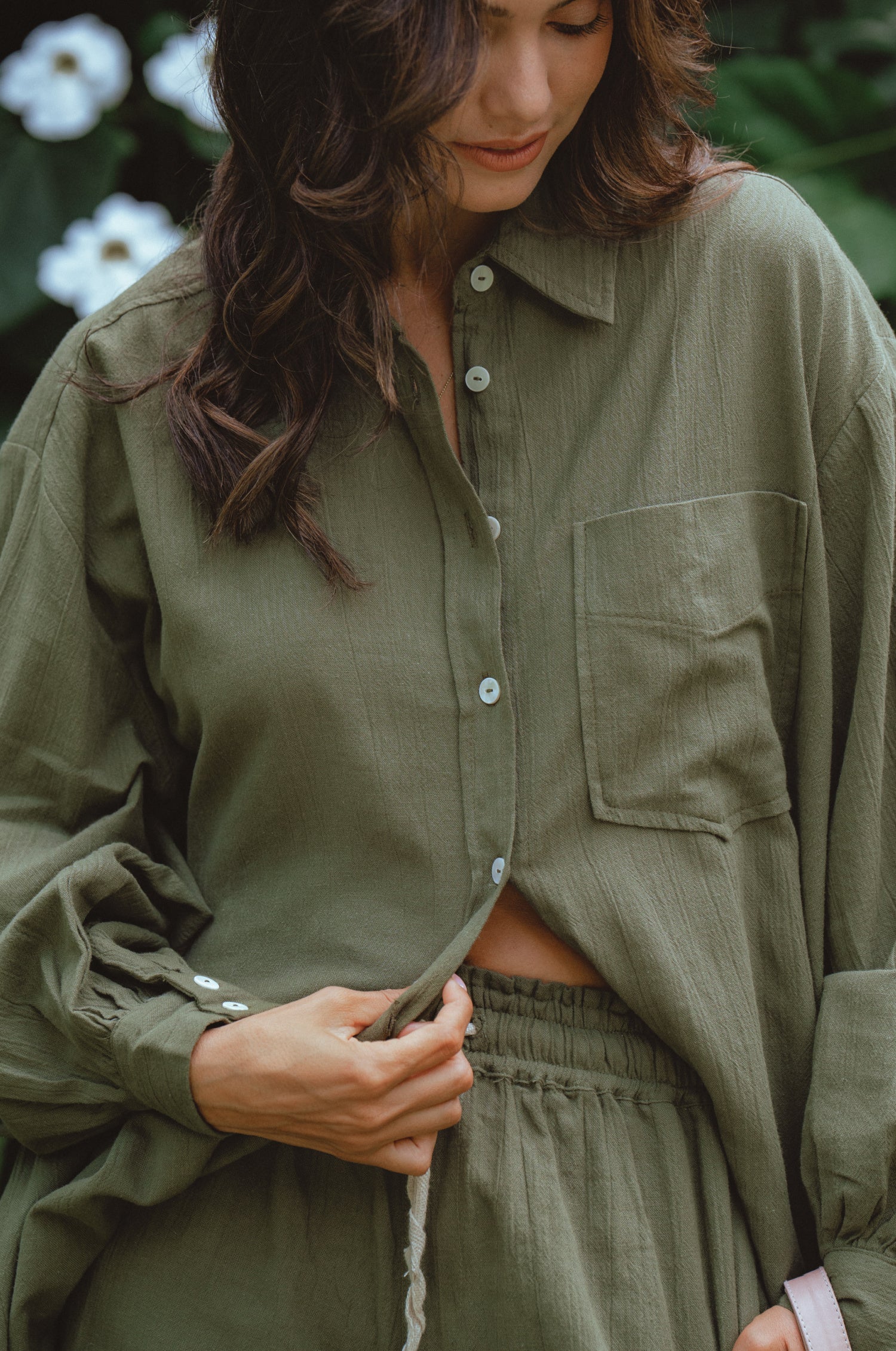 Calin Long Sleeve Oversized Shirt made from breathable linen, featuring a button-down style and high-low hem, displayed on a mannequin.