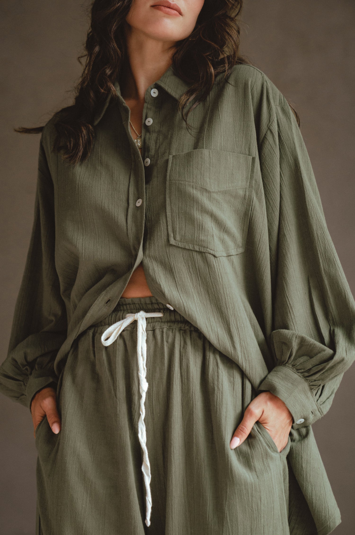 Calin Long Sleeve Oversized Shirt made from breathable linen, featuring a button-down style and high-low hem, displayed on a mannequin.