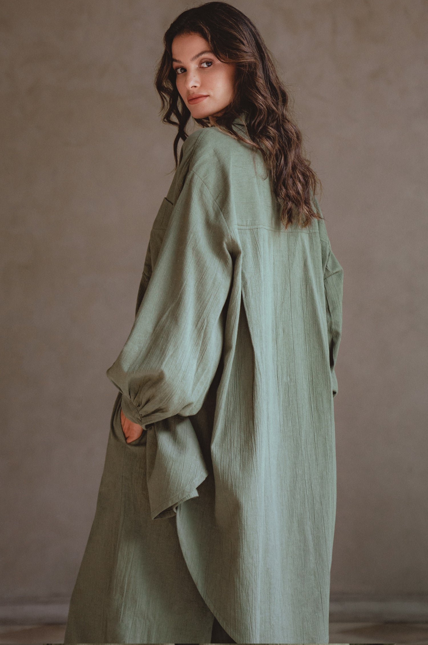 Calin Long Sleeve Oversized Shirt made from breathable linen, featuring a button-down style and high-low hem, displayed on a mannequin.