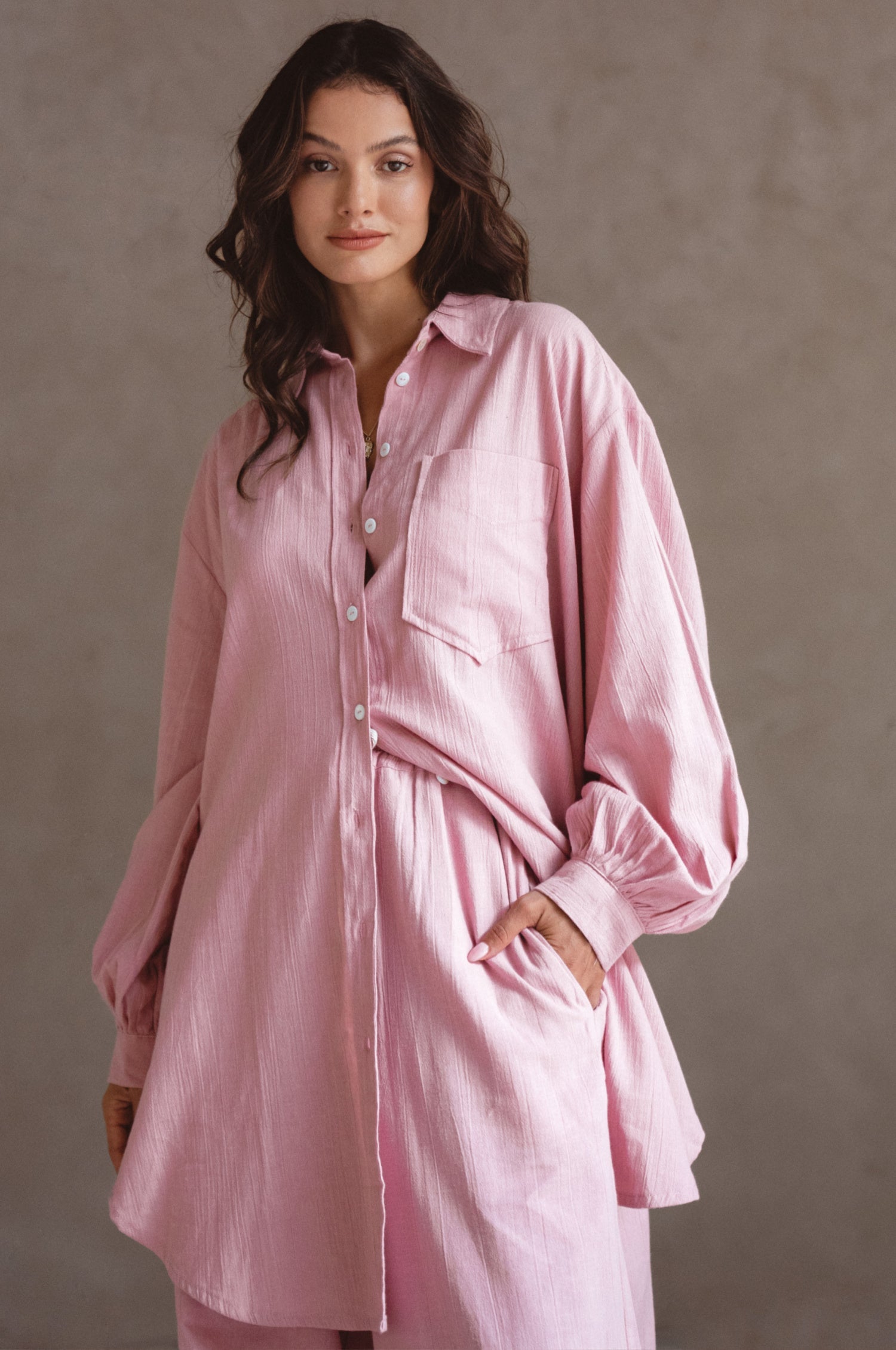 Calin Long Sleeve Oversized Shirt made from breathable linen, featuring a button-down style and high-low hem, displayed on a mannequin.