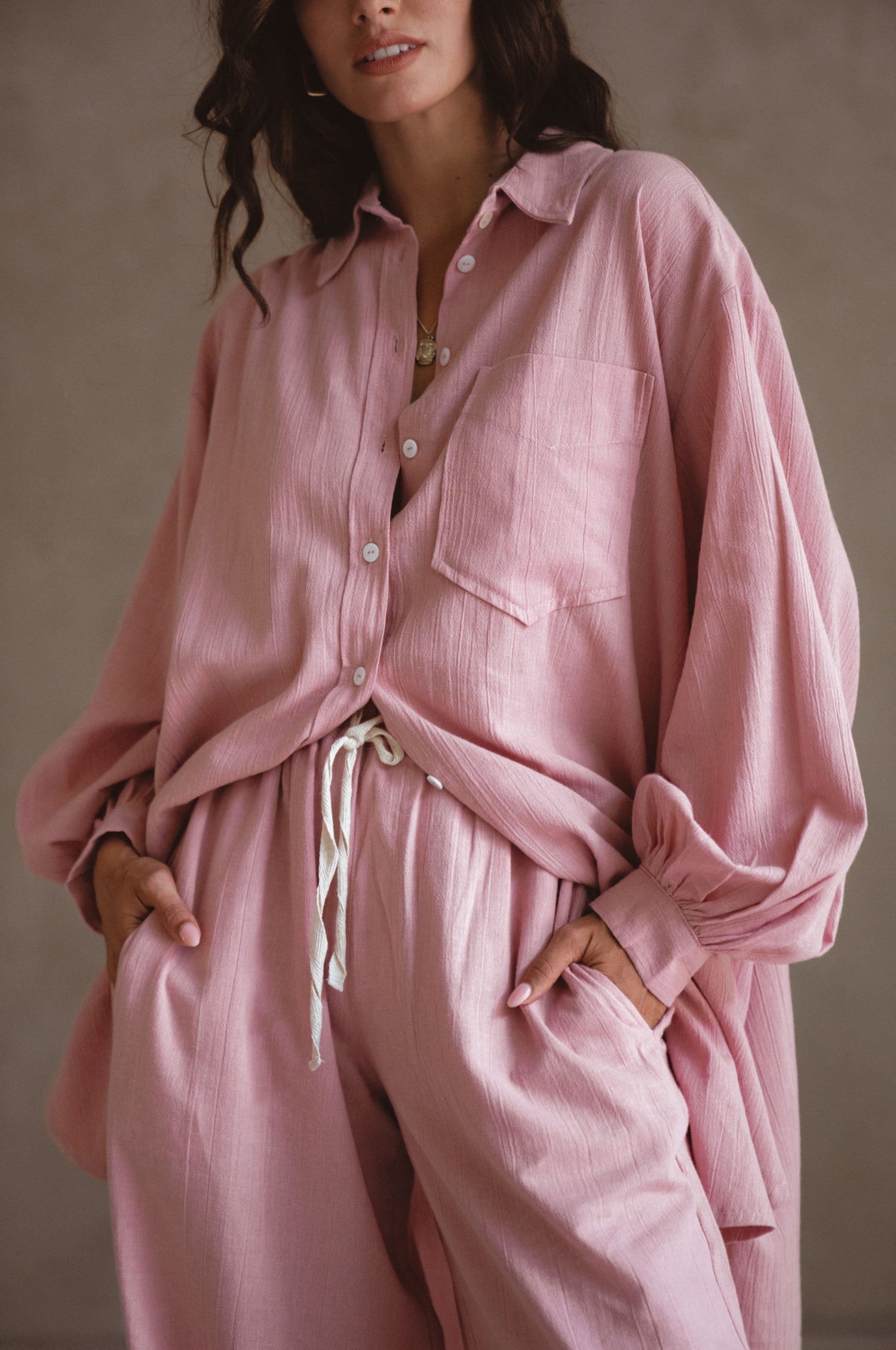 Calin Long Sleeve Oversized Shirt made from breathable linen, featuring a button-down style and high-low hem, displayed on a mannequin.