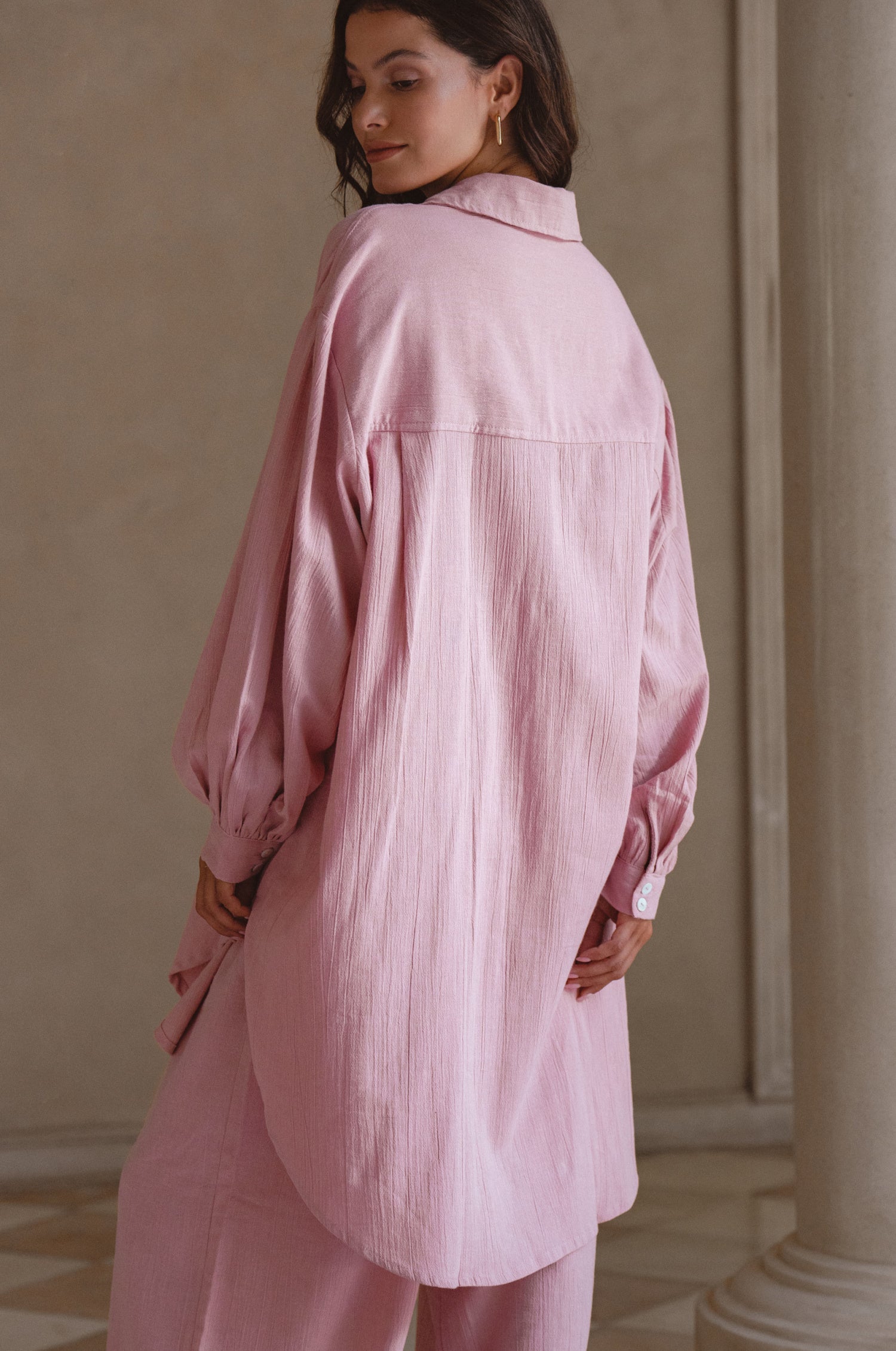 Calin Long Sleeve Oversized Shirt made from breathable linen, featuring a button-down style and high-low hem, displayed on a mannequin.