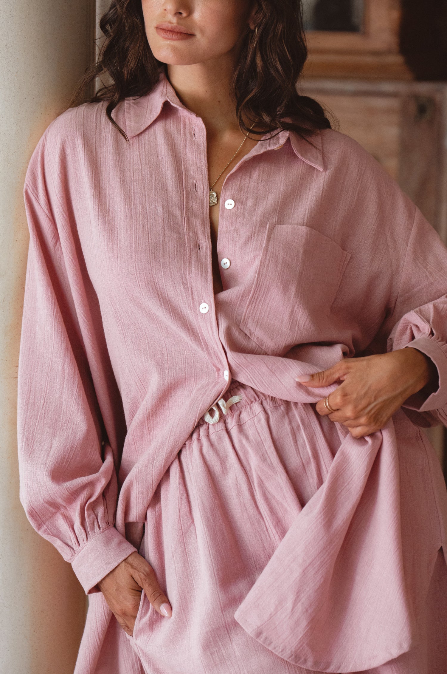 Calin Long Sleeve Oversized Shirt made from breathable linen, featuring a button-down style and high-low hem, displayed on a mannequin.