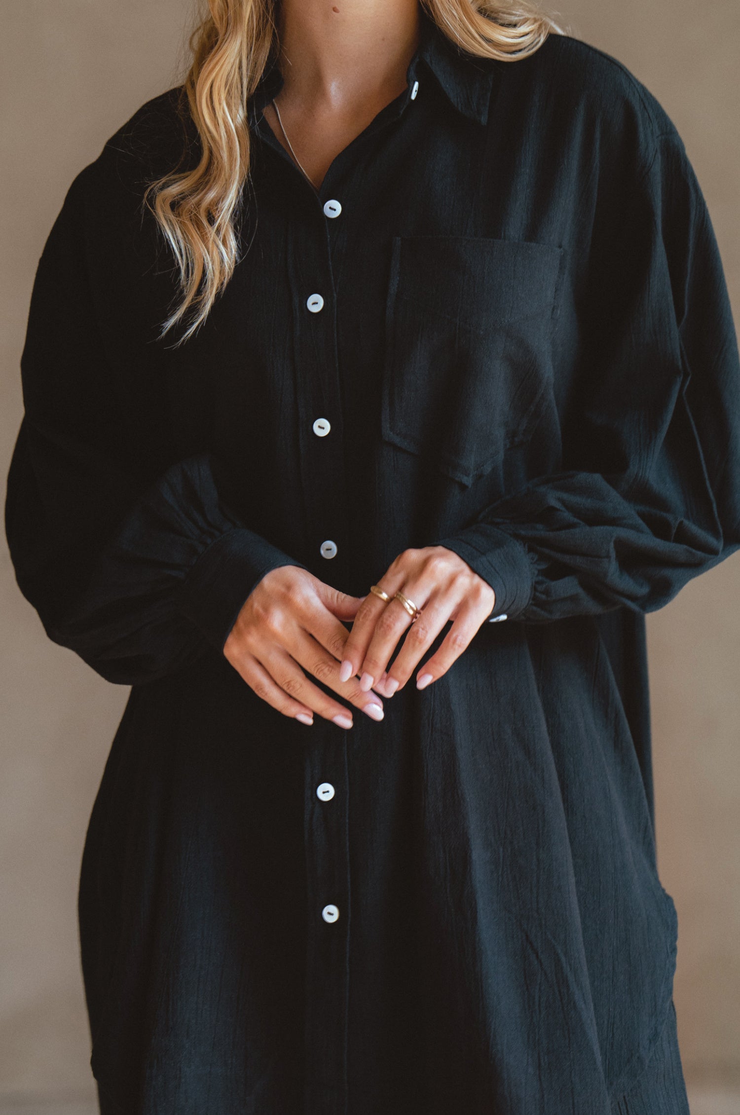 Calin Long Sleeve Oversized Shirt made from breathable linen, featuring a button-down style and high-low hem, displayed on a mannequin.