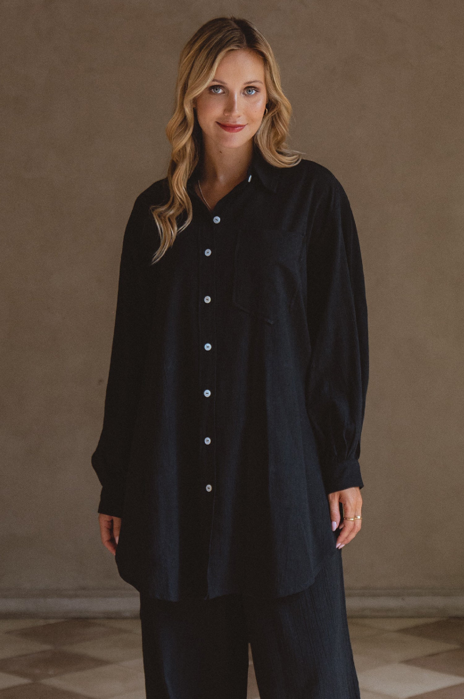 Calin Long Sleeve Oversized Shirt made from breathable linen, featuring a button-down style and high-low hem, displayed on a mannequin.