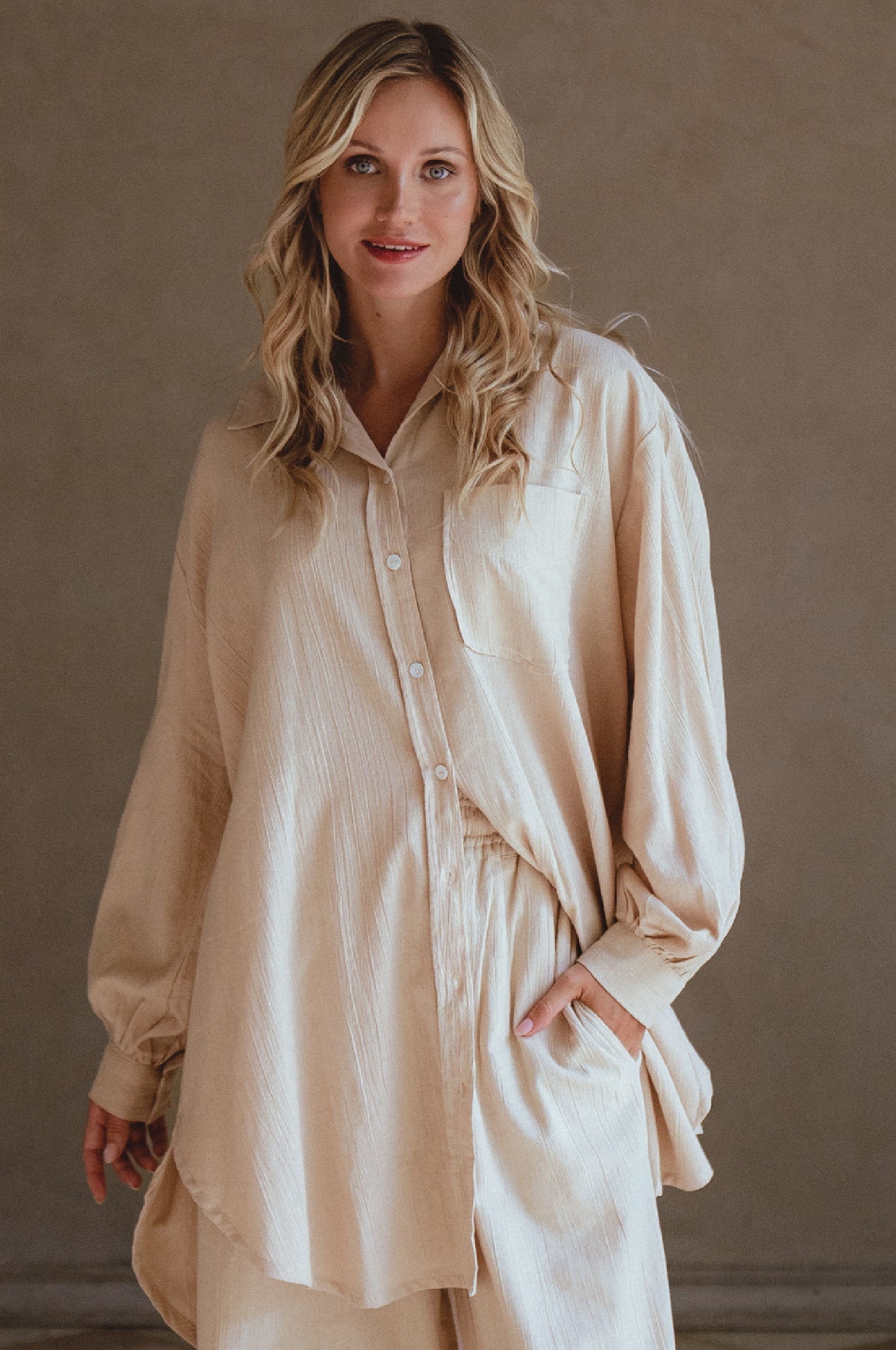 Calin Long Sleeve Oversized Shirt made from breathable linen, featuring a button-down style and high-low hem, displayed on a mannequin.