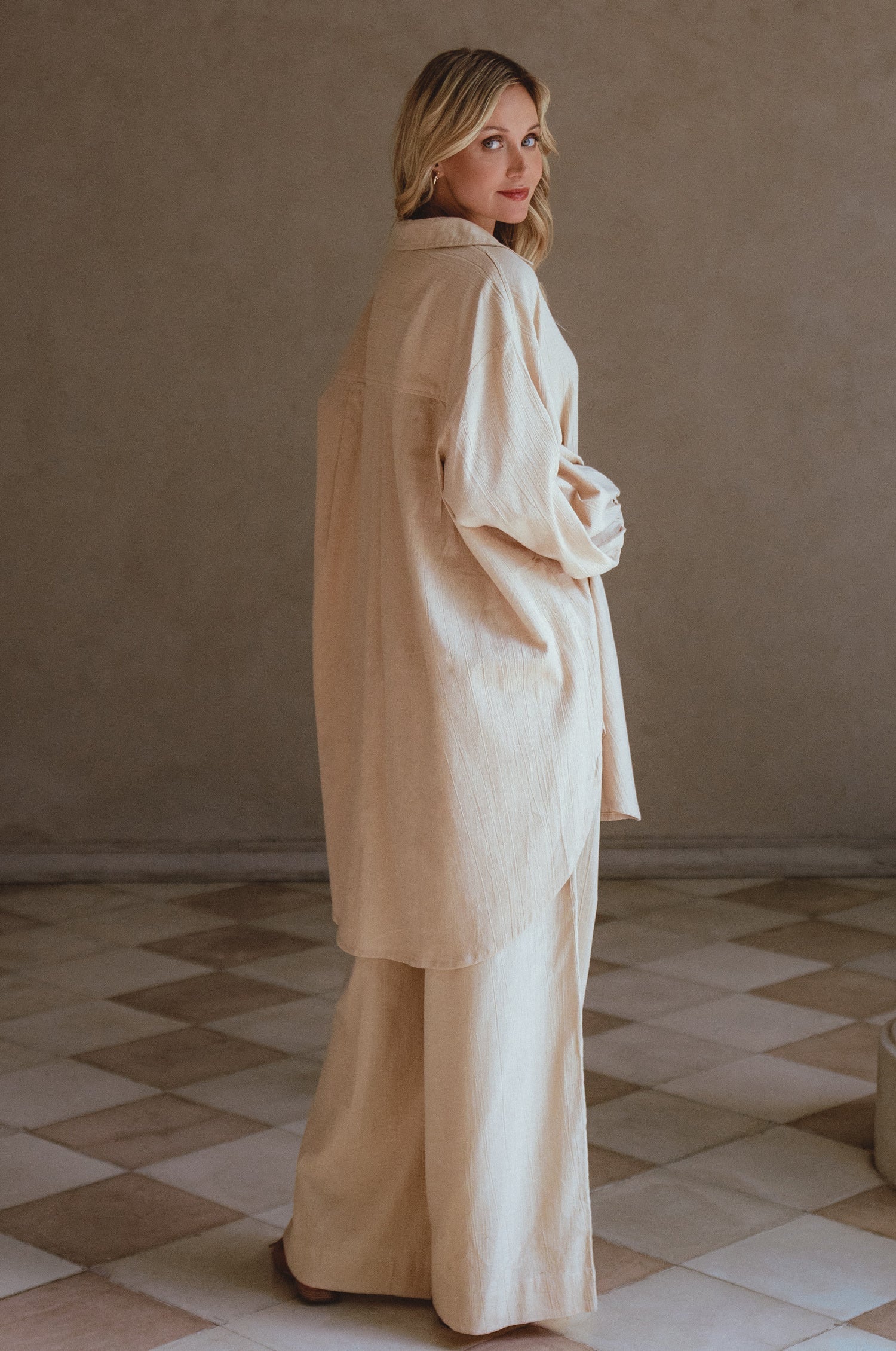 Calin Long Sleeve Oversized Shirt made from breathable linen, featuring a button-down style and high-low hem, displayed on a mannequin.