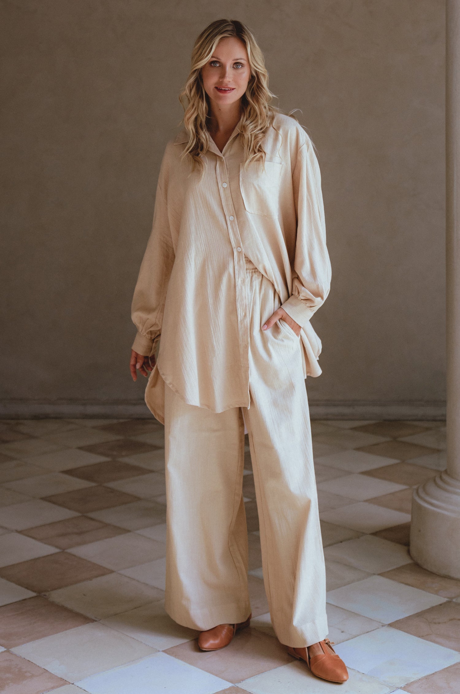 Calin Wide Leg Linen Pants in a chic wide-leg silhouette, featuring a high-rise elasticated waist and dual pockets, perfect for casual outings.