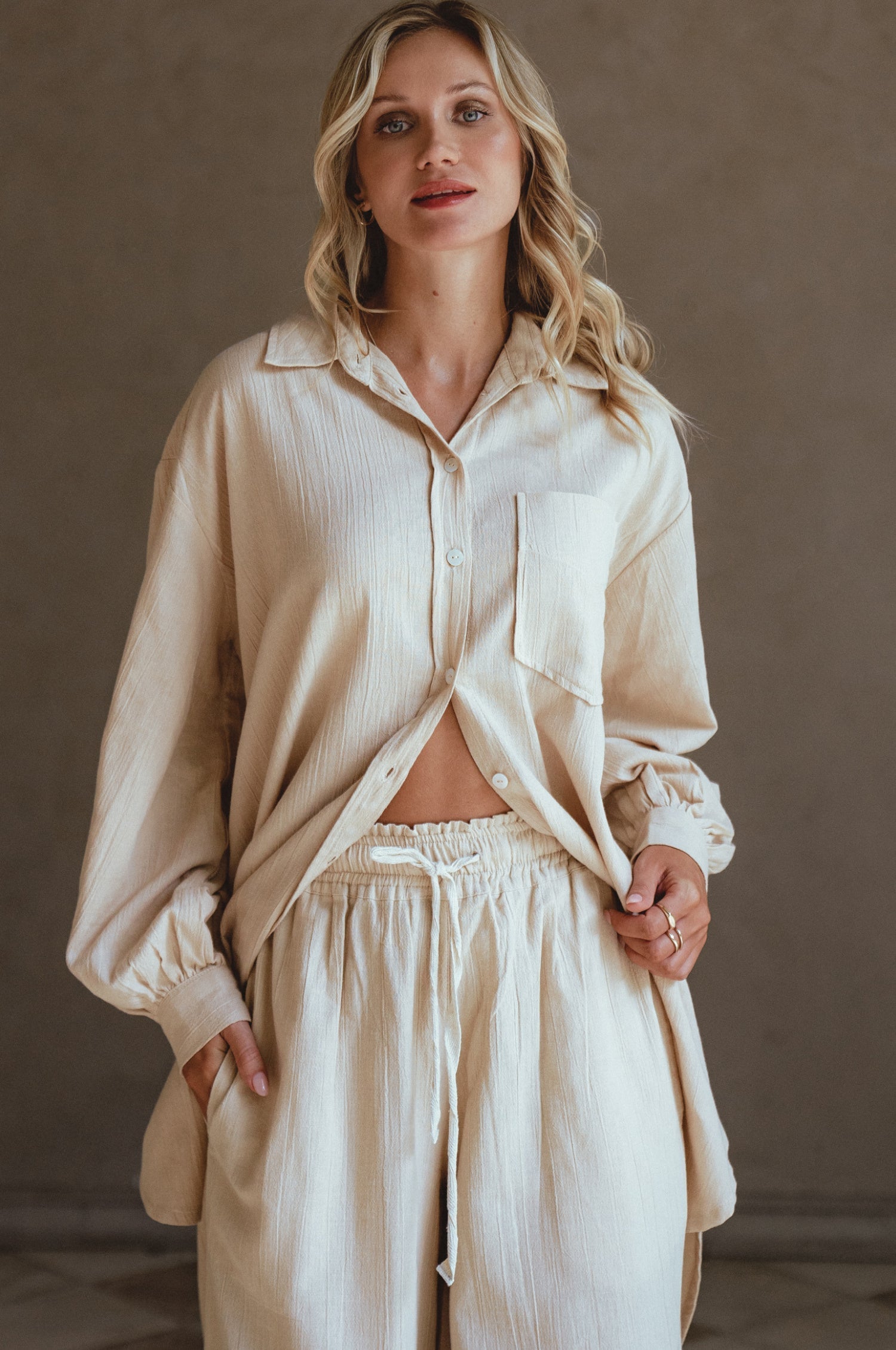 Calin Wide Leg Linen Pants in a chic wide-leg silhouette, featuring a high-rise elasticated waist and dual pockets, perfect for casual outings.