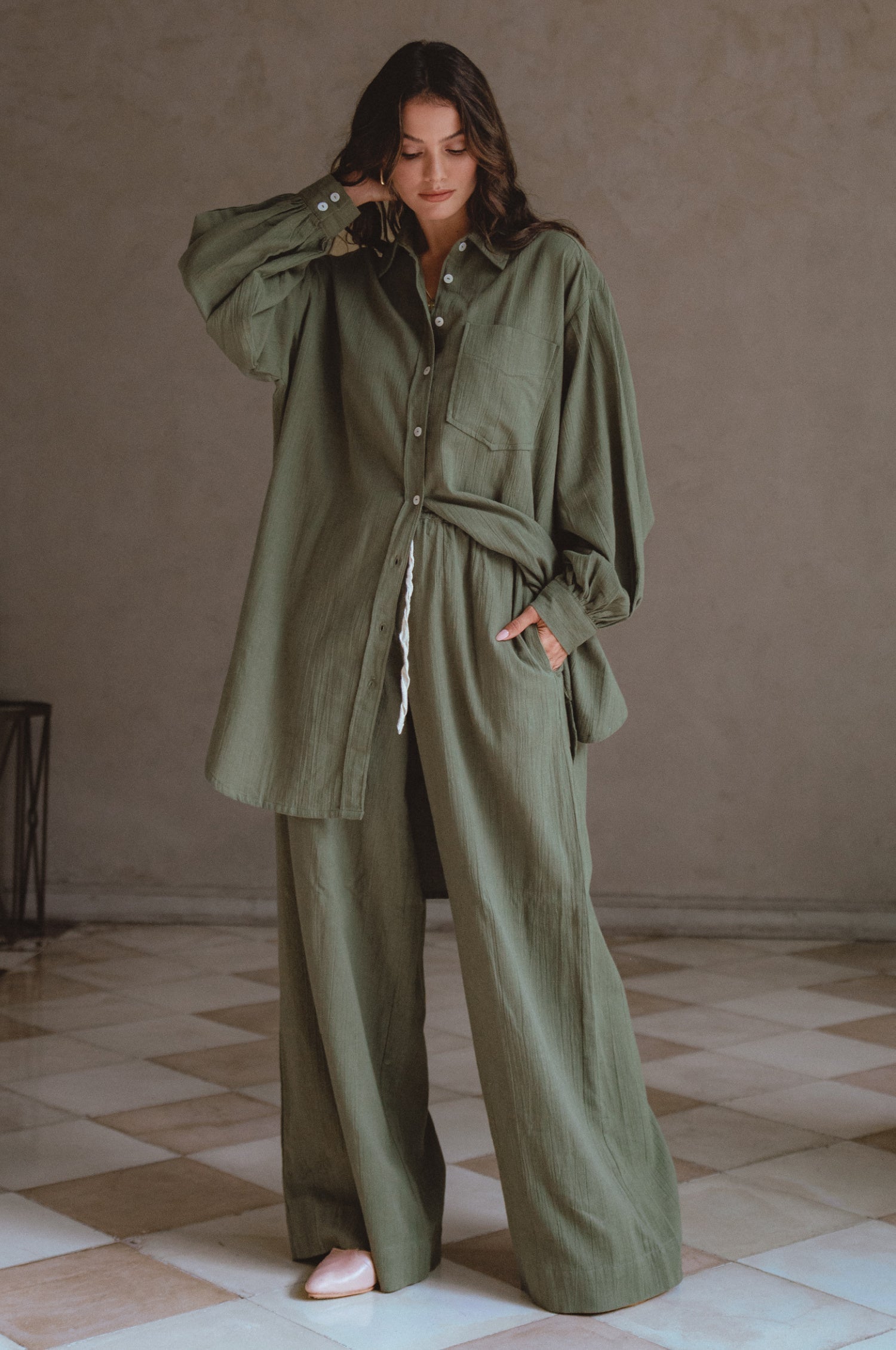 Calin Wide Leg Linen Pants in a chic wide-leg silhouette, featuring a high-rise elasticated waist and dual pockets, perfect for casual outings.