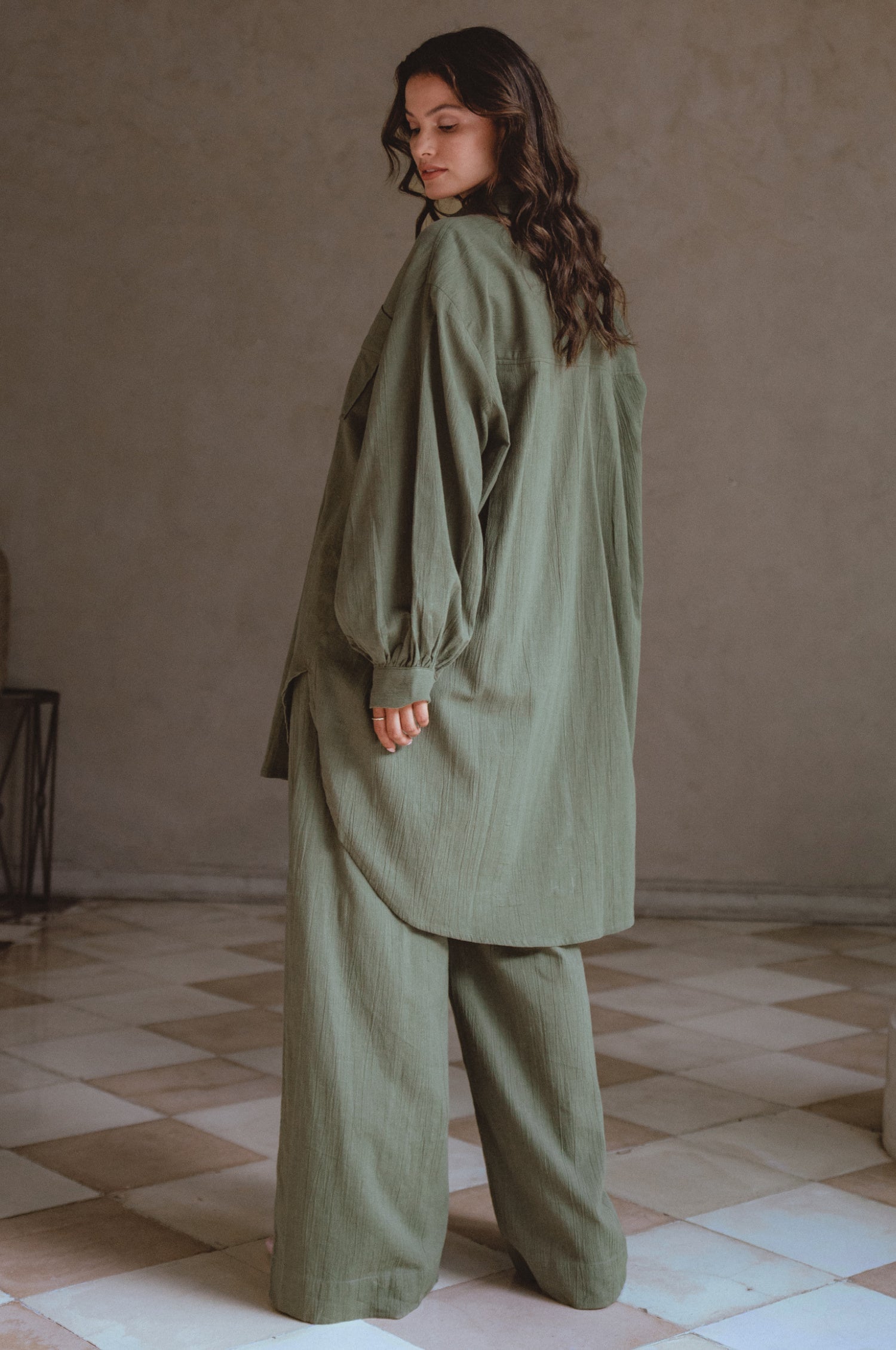 Calin Wide Leg Linen Pants in a chic wide-leg silhouette, featuring a high-rise elasticated waist and dual pockets, perfect for casual outings.