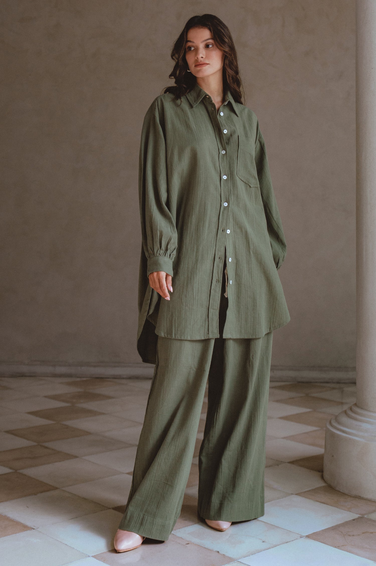 Calin Wide Leg Linen Pants in a chic wide-leg silhouette, featuring a high-rise elasticated waist and dual pockets, perfect for casual outings.