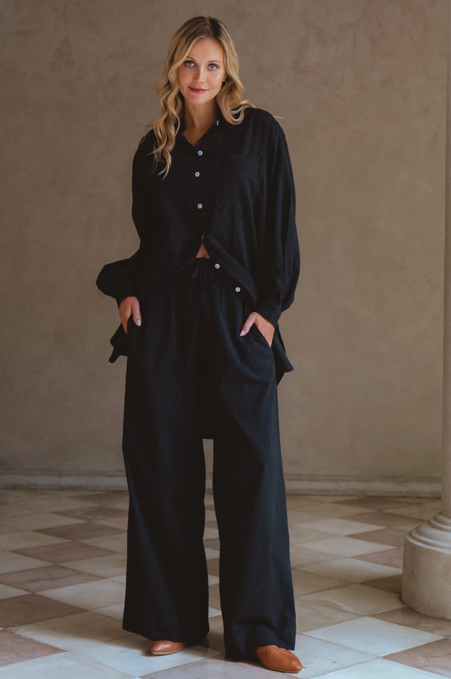 Calin Wide Leg Linen Pants in a chic wide-leg silhouette, featuring a high-rise elasticated waist and dual pockets, perfect for casual outings.