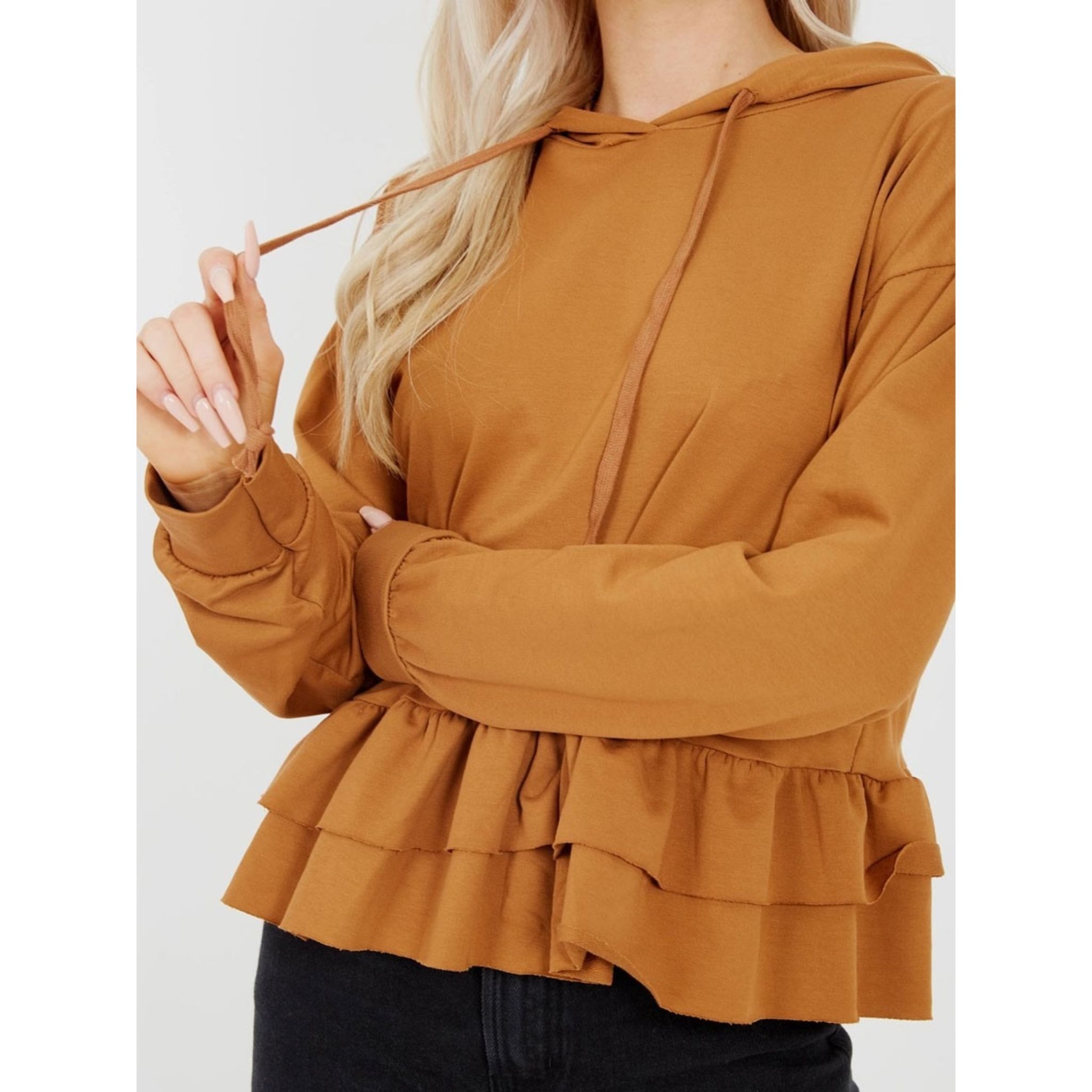 A stylish camel-colored hoodie with a layered frill hem and functional drawstring, perfect for casual wear.