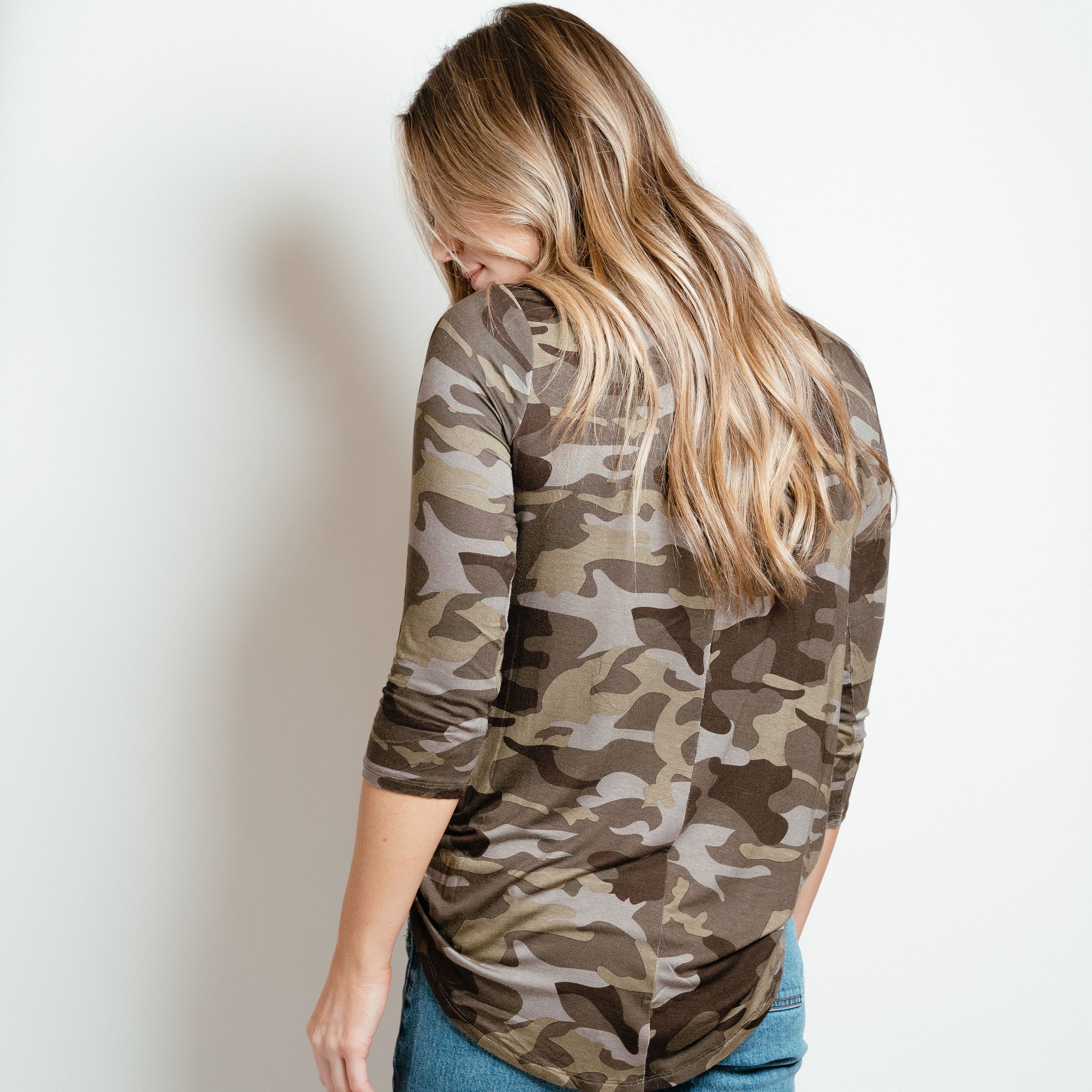 Camo 3/4 sleeve top in green, featuring a stylish camo print and comfortable fit, perfect for layering in spring.