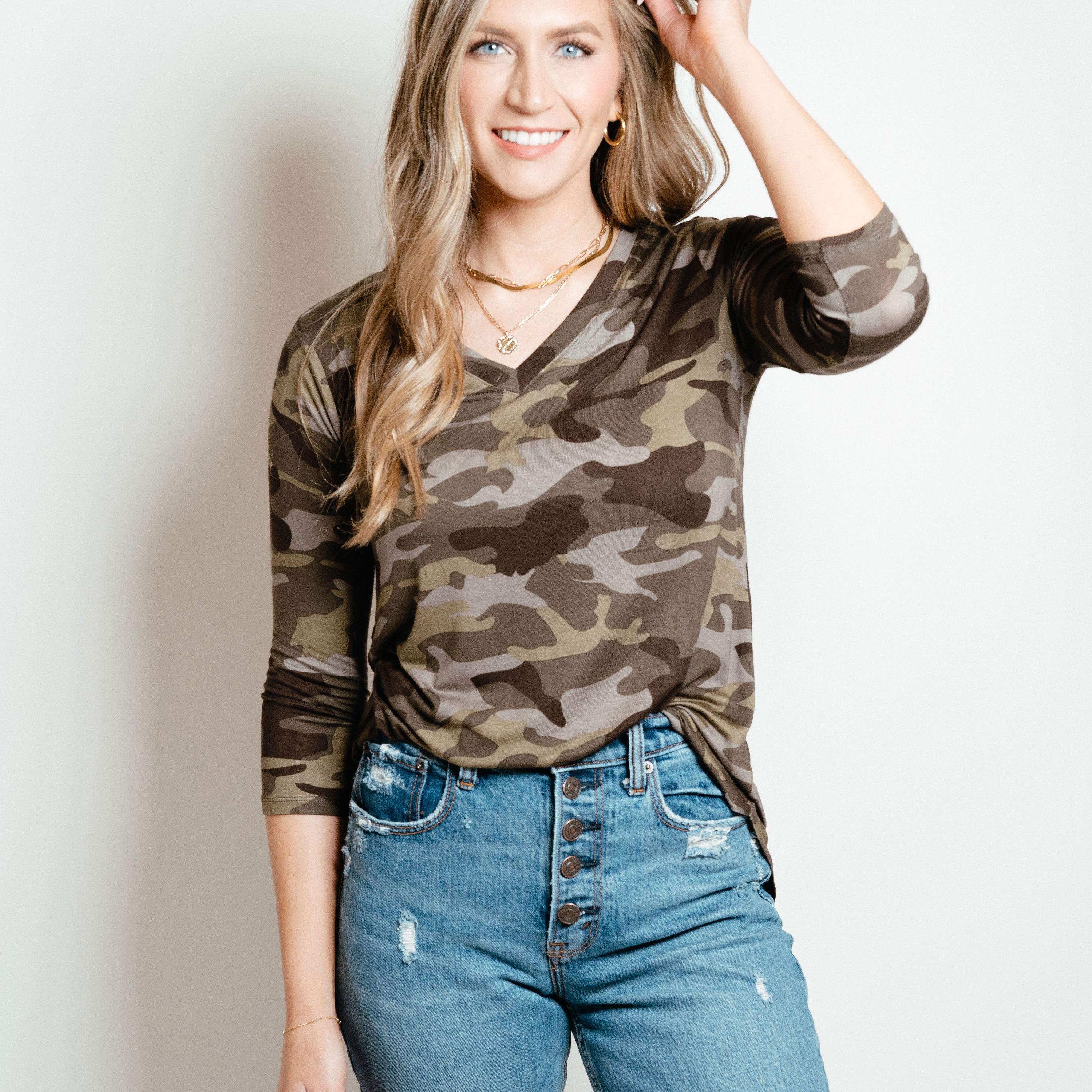 Camo 3/4 sleeve top in green, featuring a stylish camo print and comfortable fit, perfect for layering in spring.