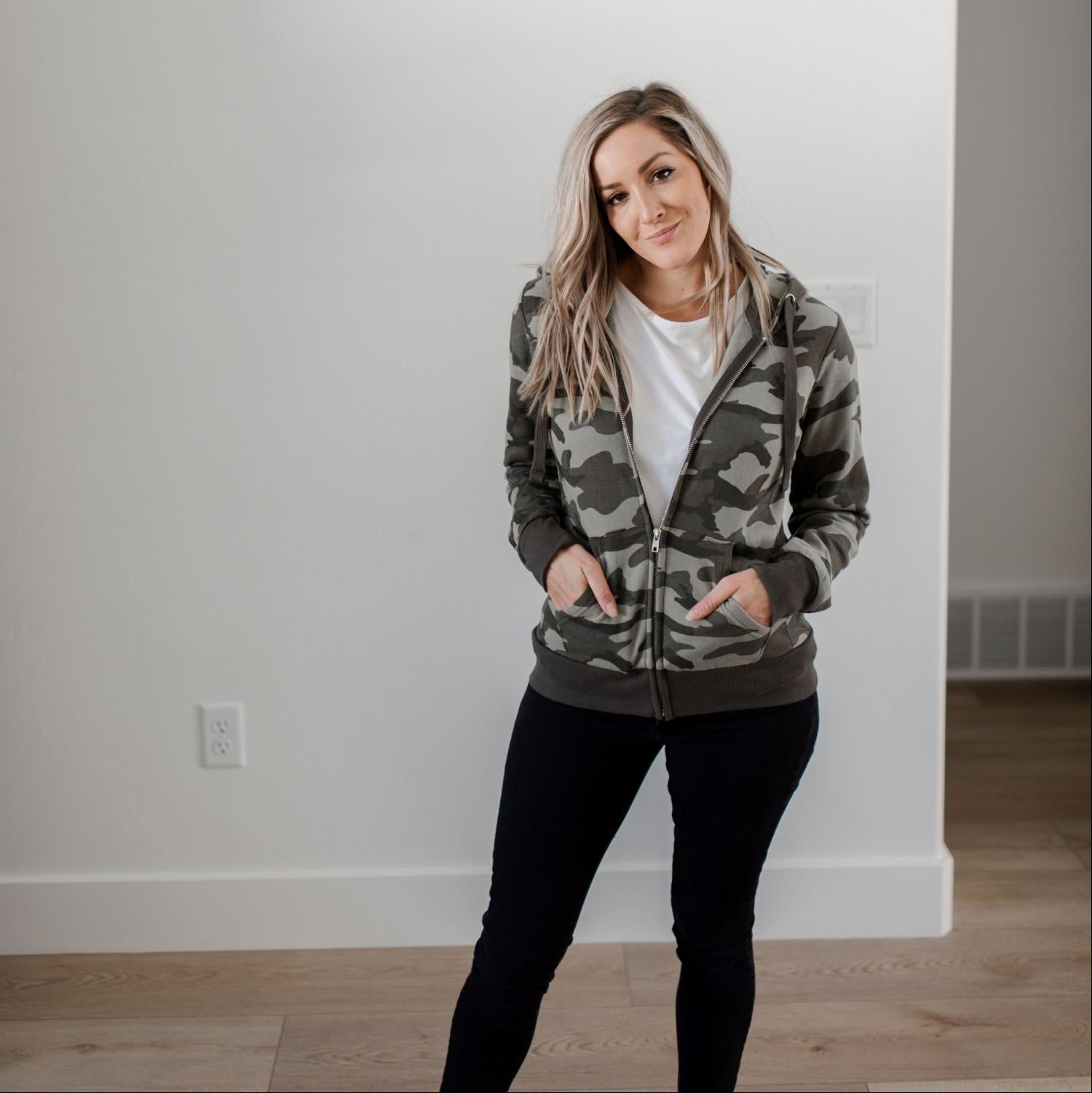 A stylish camouflage fleece zip-up hoodie jacket with ribbed hem and cuffs, featuring an adjustable hood, perfect for casual wear.