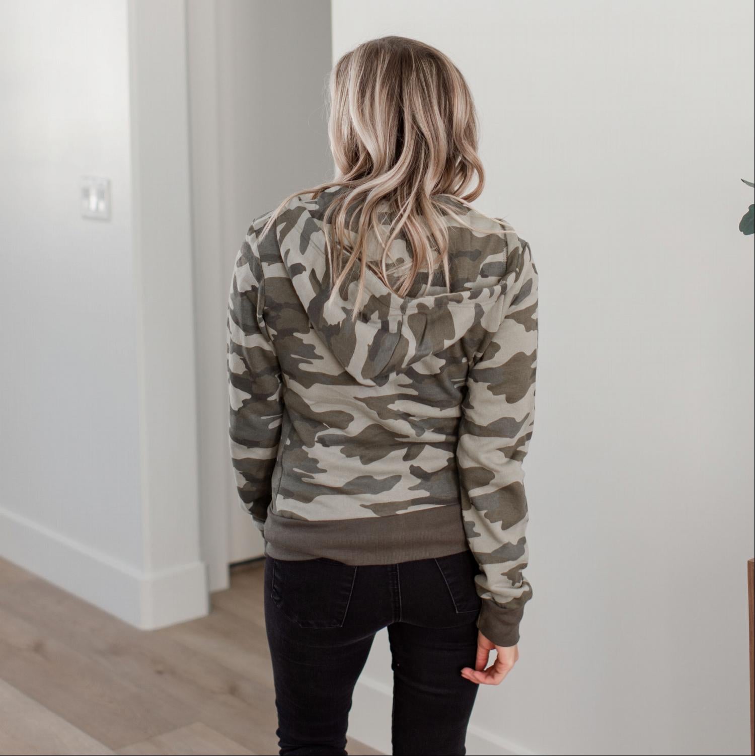 A stylish camouflage fleece zip-up hoodie jacket with ribbed hem and cuffs, featuring an adjustable hood, perfect for casual wear.