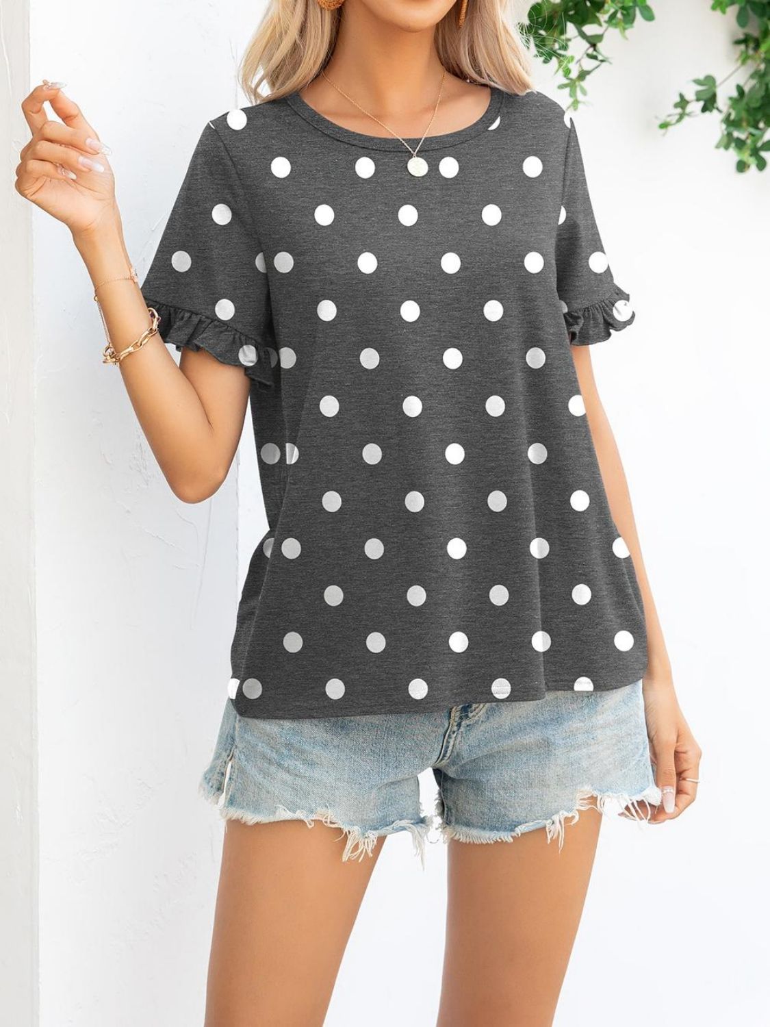 Camouflage Flounce Sleeve Tee Shirt featuring a stylish camouflage and polka dot pattern with flounce sleeves.