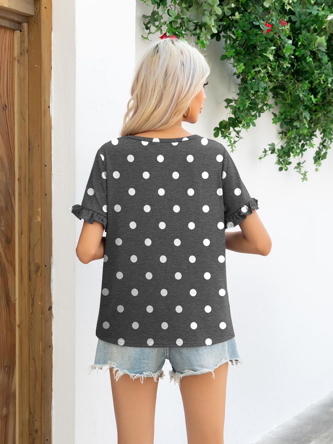 Camouflage Flounce Sleeve Tee Shirt featuring a stylish camouflage and polka dot pattern with flounce sleeves.