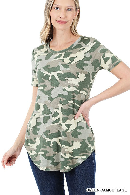 A stylish woman wearing a Cool Camo Tee featuring a round neck and all-over camouflage print, perfect for casual outings.