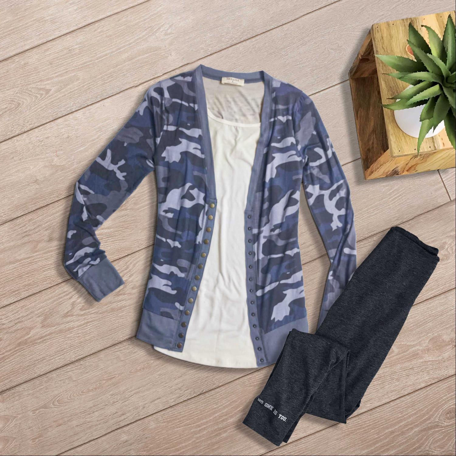 A stylish camouflage print snap button cardigan displayed on a mannequin, featuring a trendy design and casual fit.