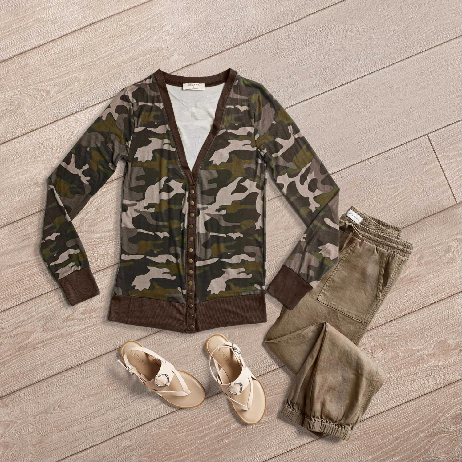 A stylish camouflage print snap button cardigan displayed on a mannequin, featuring a trendy design and casual fit.