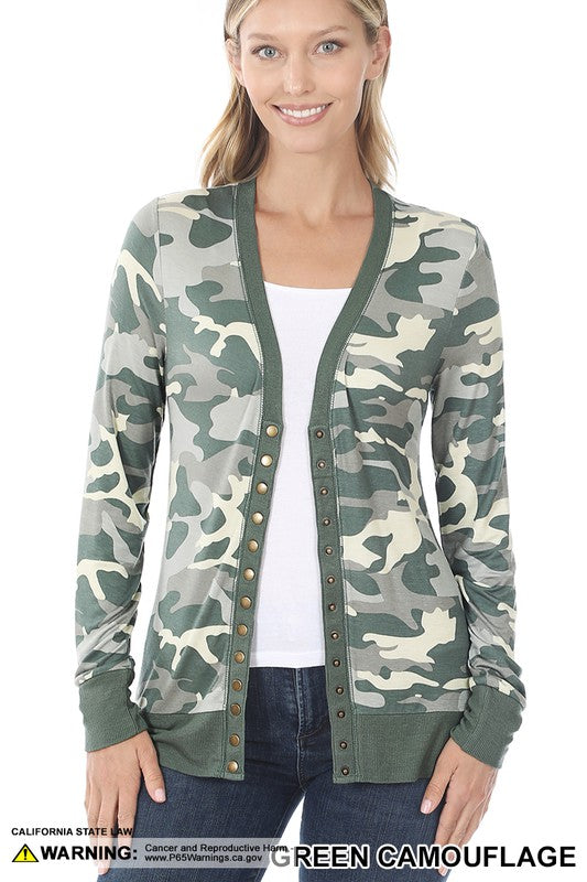 A stylish camouflage print snap button cardigan displayed on a mannequin, featuring a trendy design and casual fit.