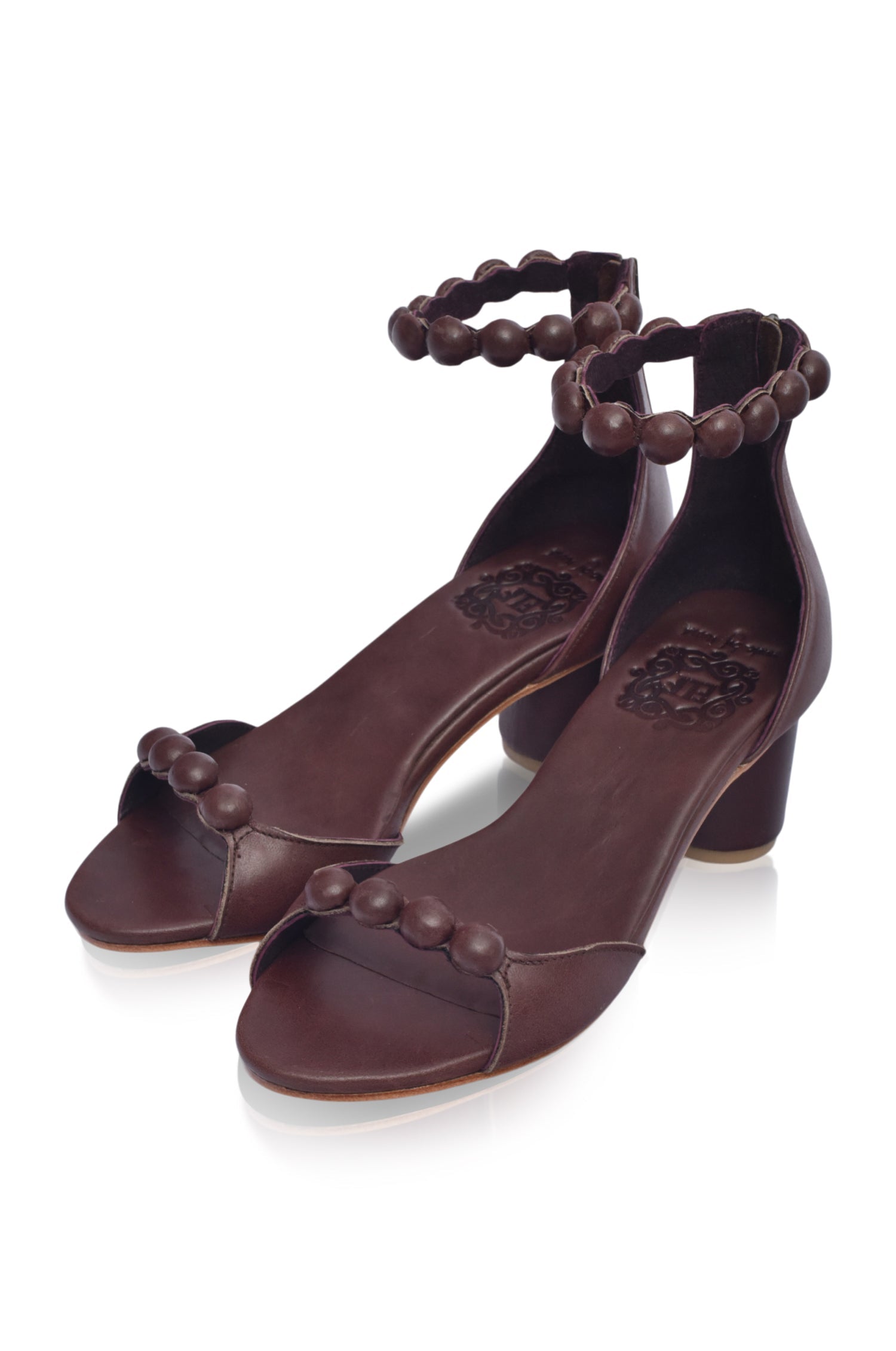 Candy Round Heel Sandals featuring leather-covered buttons and a lightweight wooden heel, perfect for summer outfits.