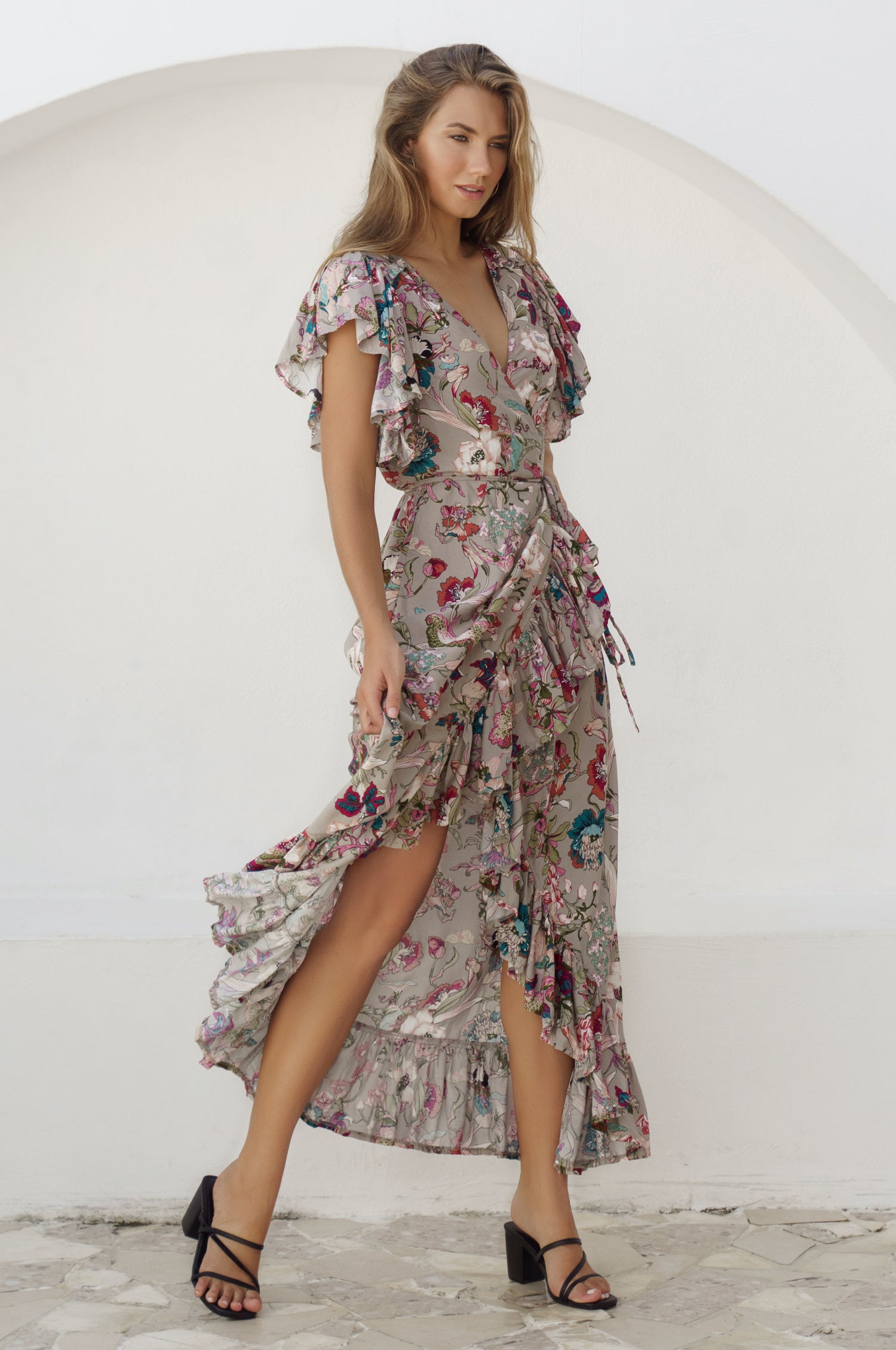 Carmen Wrap Maxi Dress featuring a soft rayon fabric, frilled hem, and a self-fabric tie at the waist, perfect for stylish occasions.