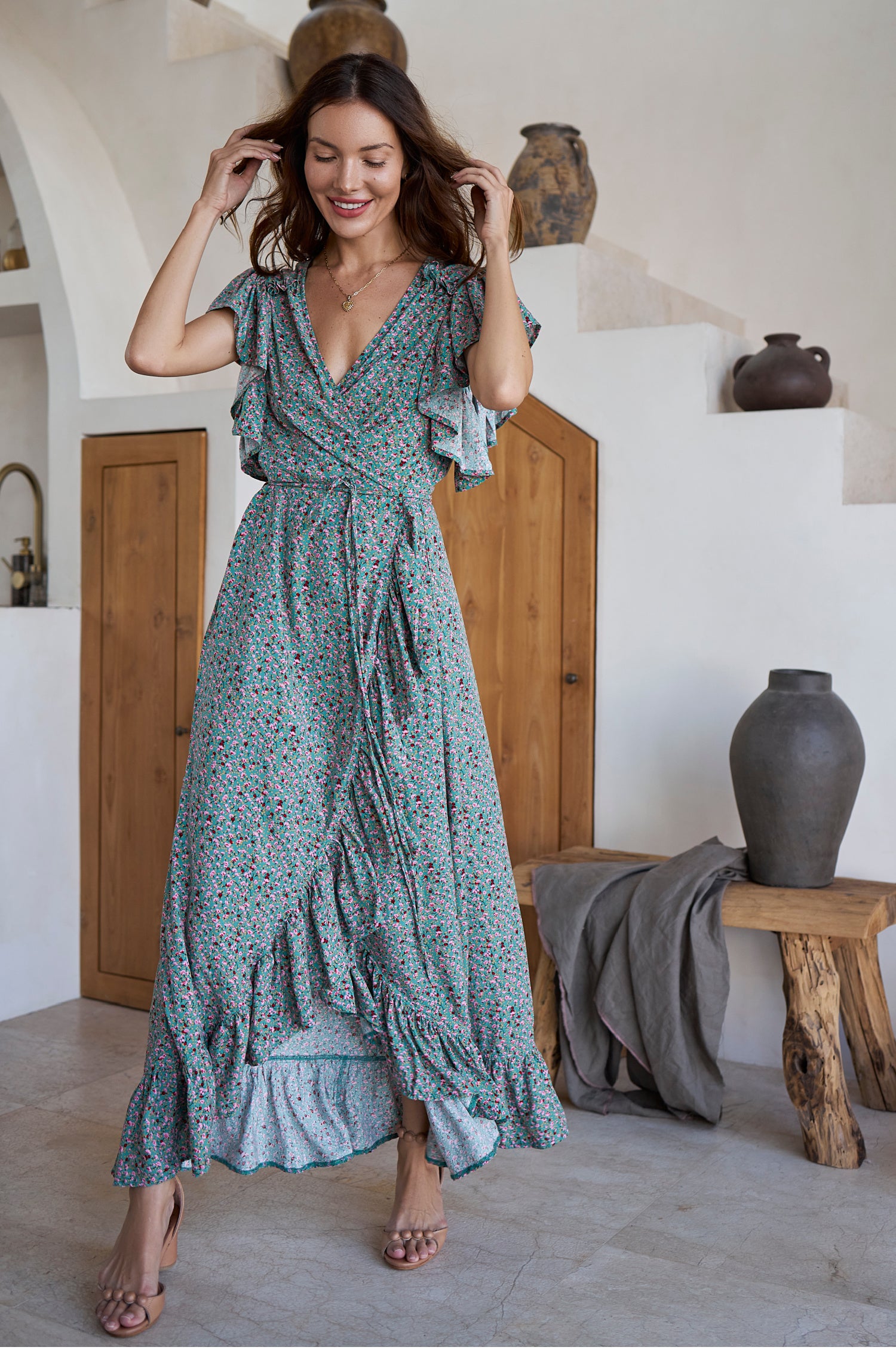 Carmen Wrap Maxi Dress featuring a soft rayon fabric, frilled hem, and a self-fabric tie at the waist, perfect for stylish occasions.