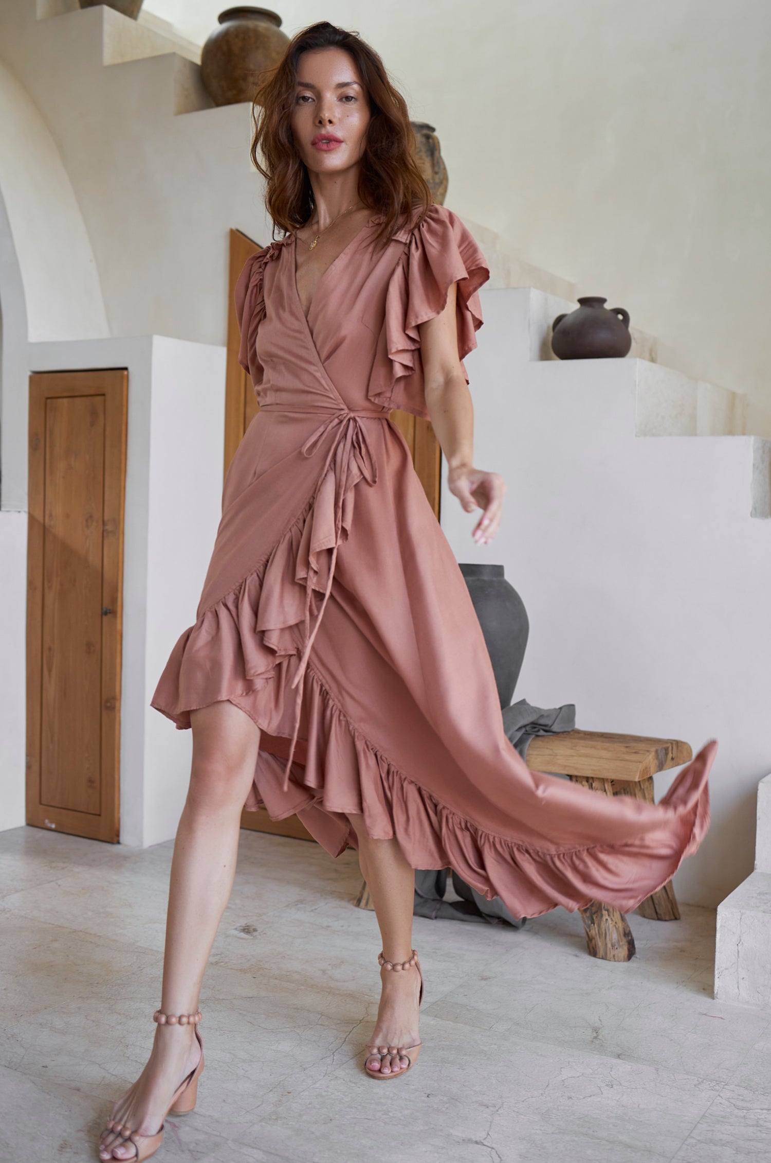 Carmen Wrap Maxi Dress featuring a soft rayon fabric, frilled hem, and a self-fabric tie at the waist, perfect for stylish occasions.