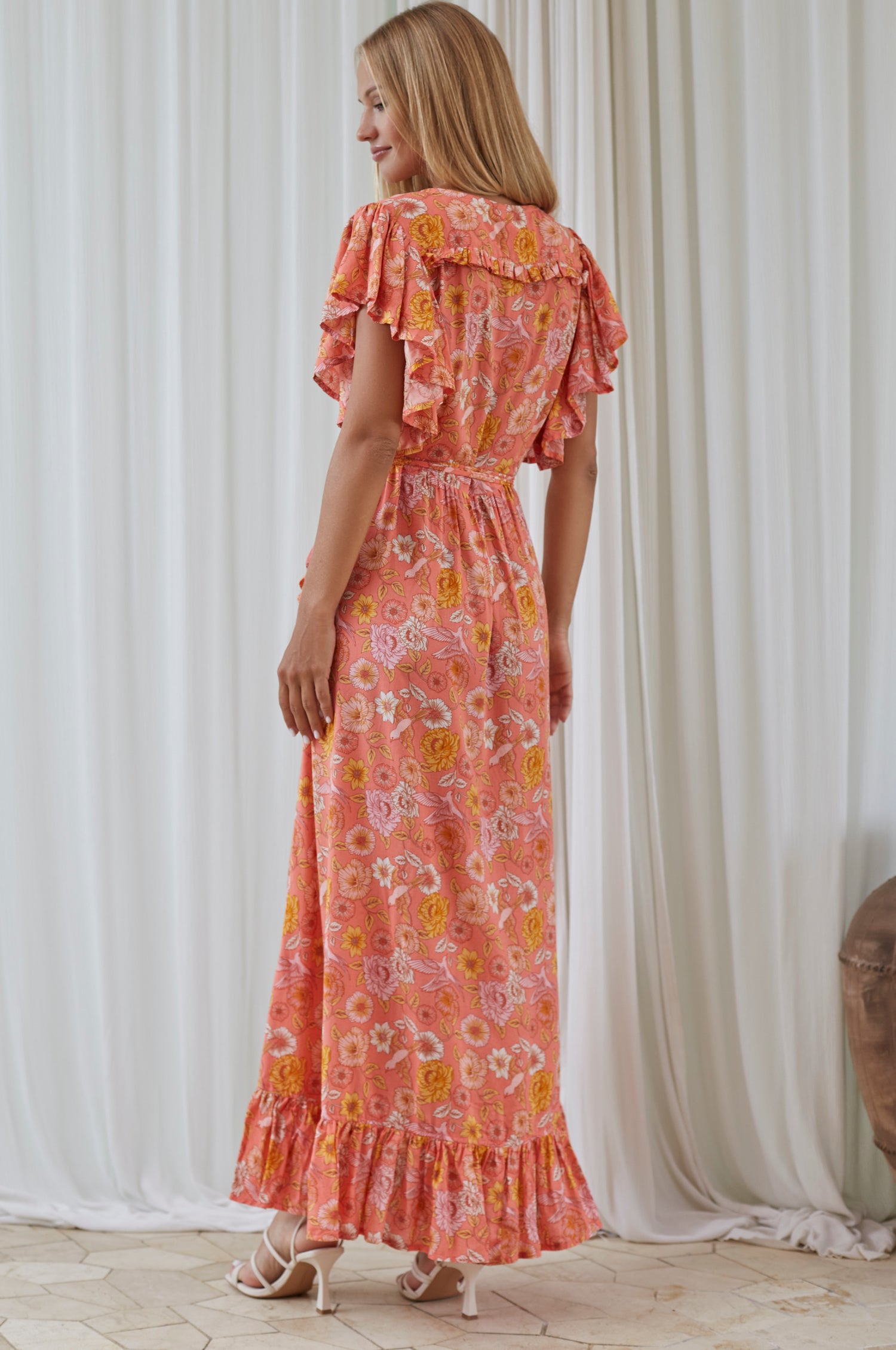 Carmen Wrap Maxi Dress in soft rayon fabric with a leg-split design, featuring a frilled hem and self-tie waist.