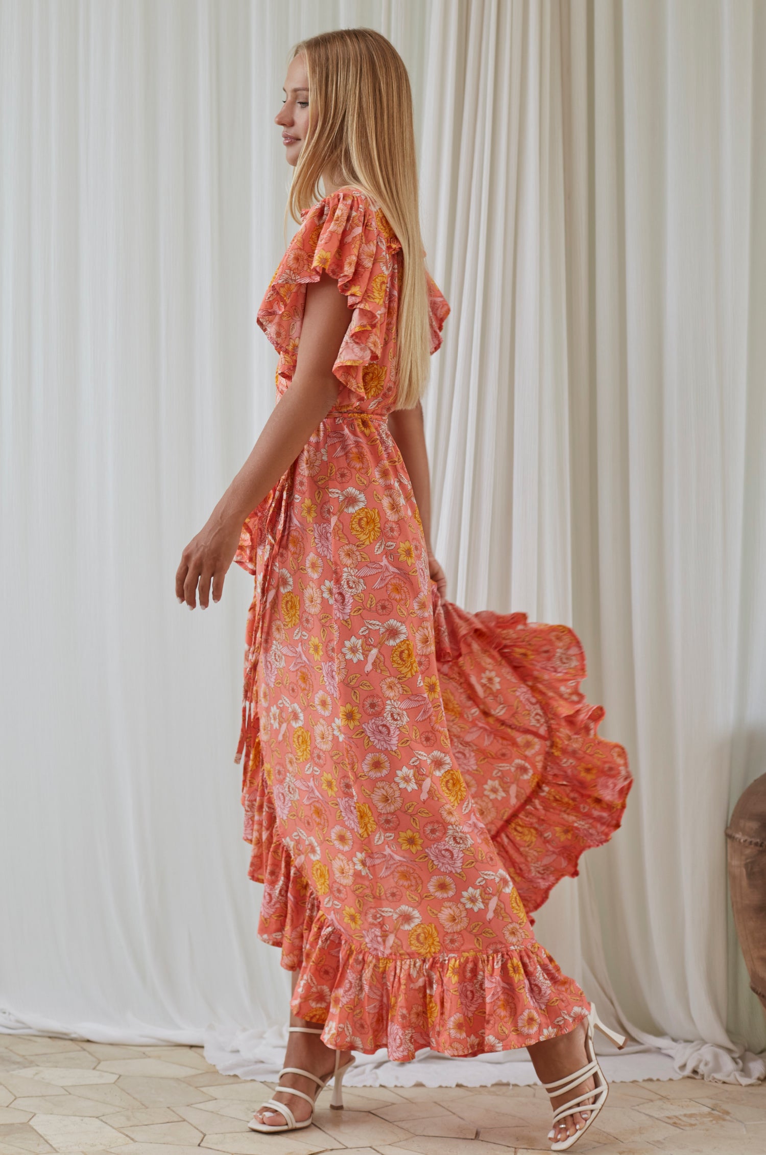 Carmen Wrap Maxi Dress in soft rayon fabric with a leg-split design, featuring a frilled hem and self-tie waist.